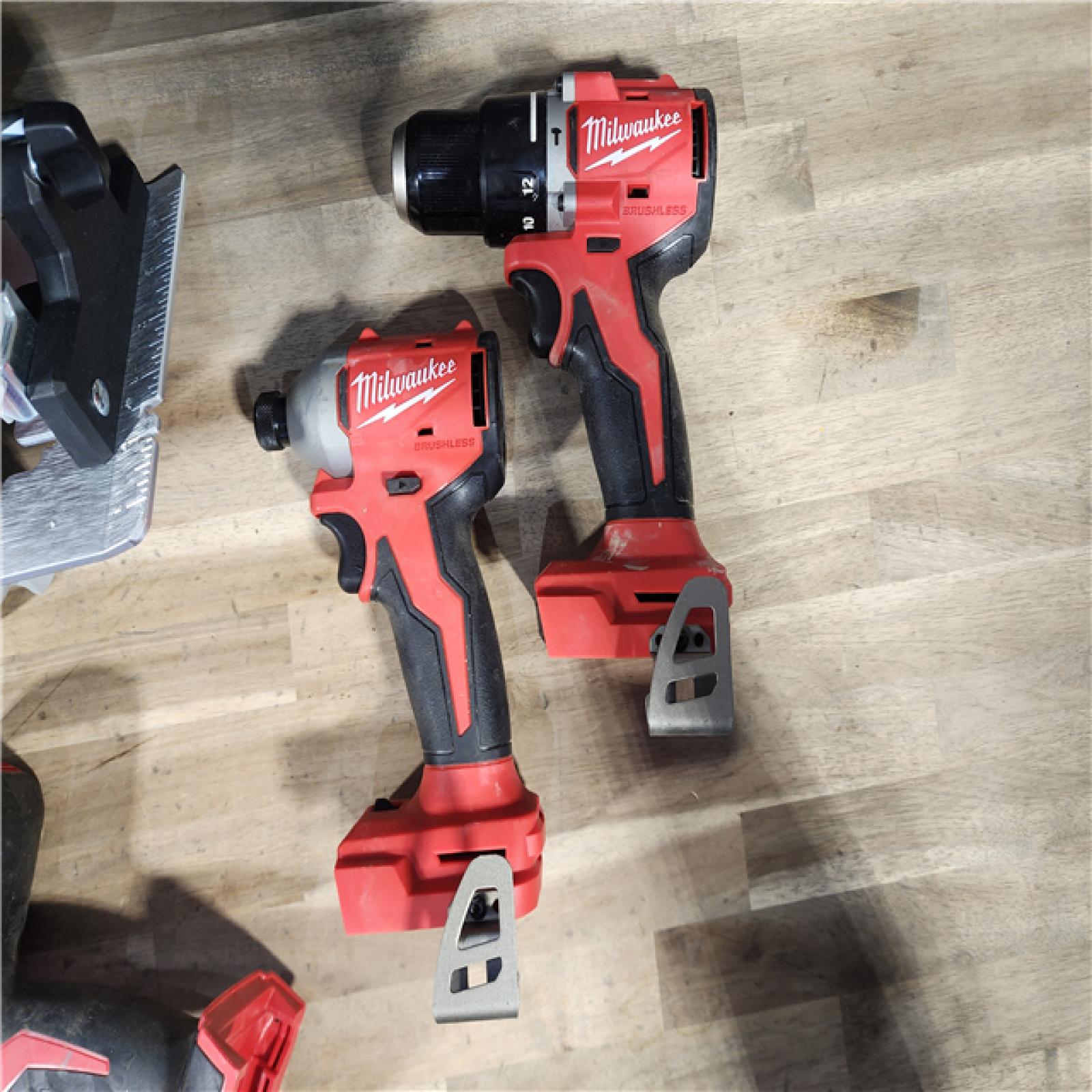 HOUSTON LOCATION - AS-IS Milwaukee M18 18-Volt Lithium-Ion Brushless Cordless Combo Kit (4-Tool) with 2-Batteries, 1-Charger and Tool Bag