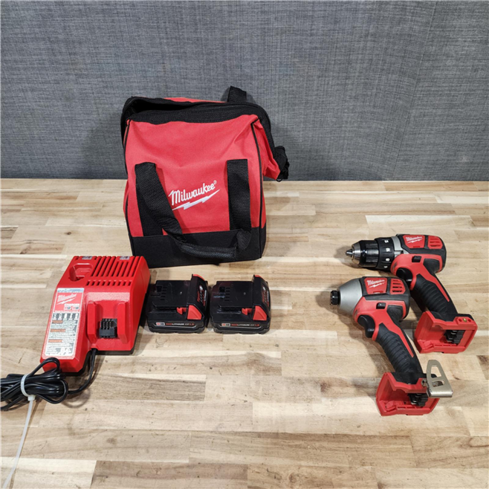 HOUSTON LOCATION - AS-IS Milwaukee  18V Lithium-Ion Cordless Drill Driver/Impact Driver Combo Kit