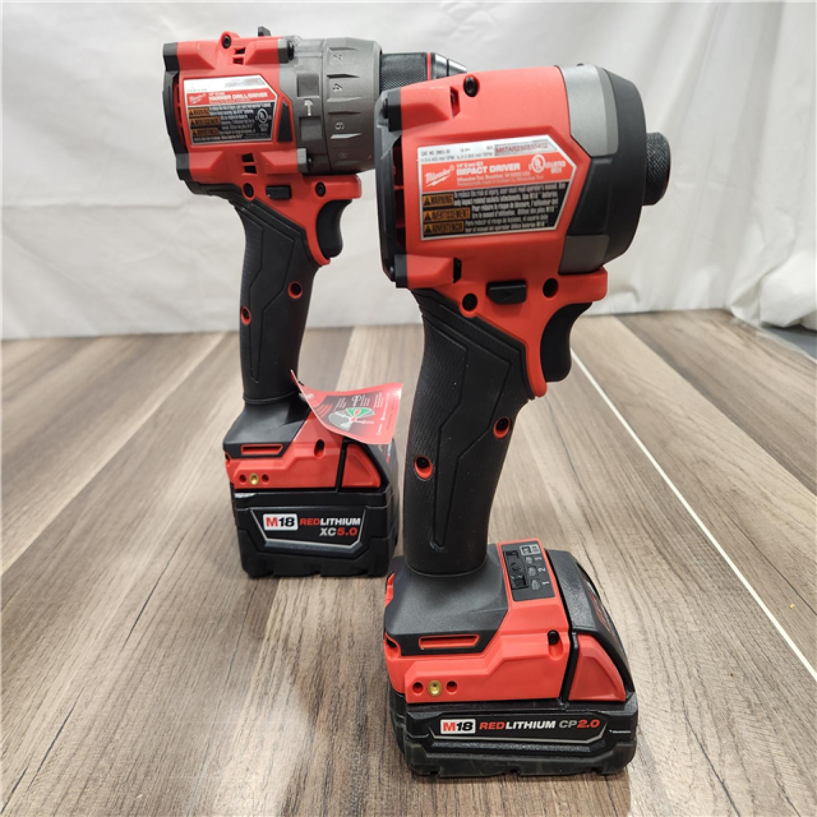 AS-IS- MILWAUKEE FUEL 18V Lithium-Ion Brushless Cordless Hammer Drill and Impact Driver Combo Kit (2-Tool) with 2 Batteries