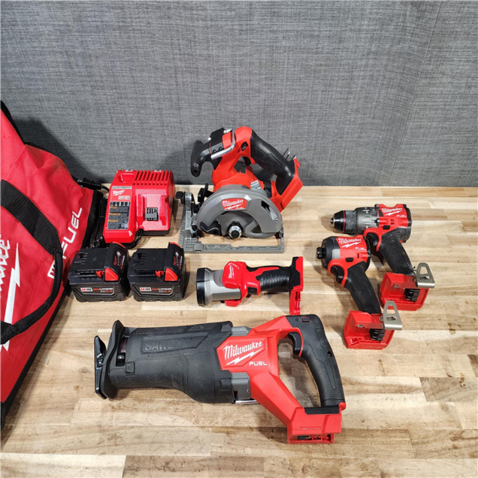 HOUSTON LOCATION - AS-IS M18 FUEL 18V Lithium-Ion Brushless Cordless Combo Kit (5-Tool) with Two 5.0 Ah Batteries  1 Charger 1 Tool Bag