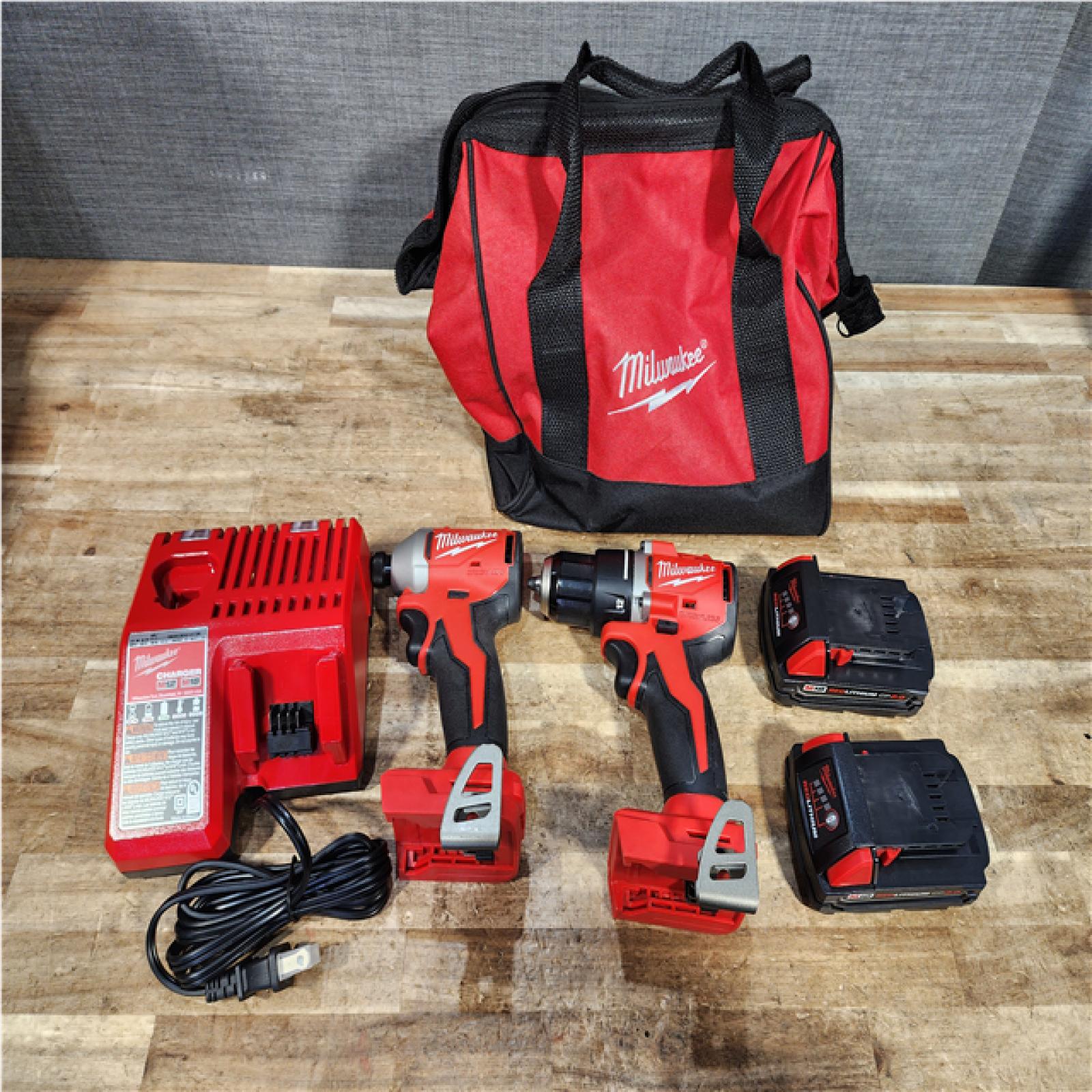 Houston  Location AS-IS Milwaukee 18V Lithium-Ion Brushless Cordless Compact Drill/Impact Combo Kit