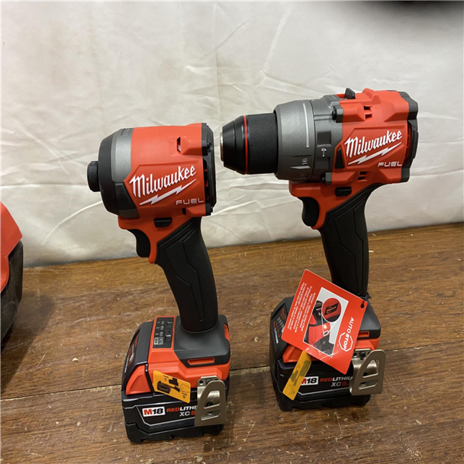 AS-IS MILWAUKEE M18 FUEL 18V Lithium-Ion Brushless Cordless Hammer Drill and Impact Driver Combo Kit (2-Tool) with 2 Batteries