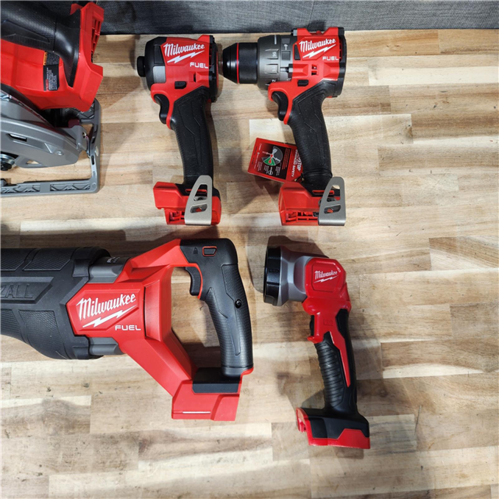 HOUSTON LOCATION - AS-IS M18 FUEL 18V Lithium-Ion Brushless Cordless Combo Kit (5-Tool) with Two 5.0 Ah Batteries  1 Charger 1 Tool Bag