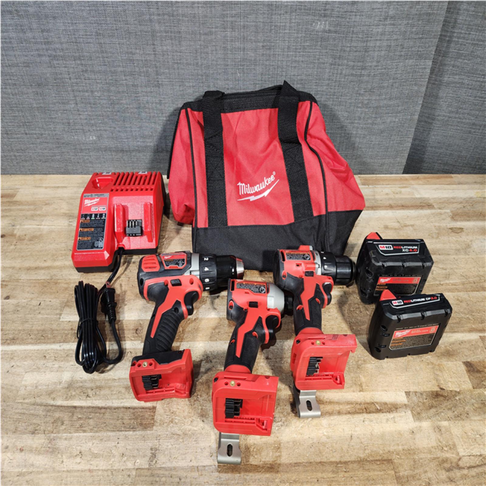 Houston Location AS-IS Milwaukee Drills QTY/2 and Impact and Batteries QTY/2 and Charger