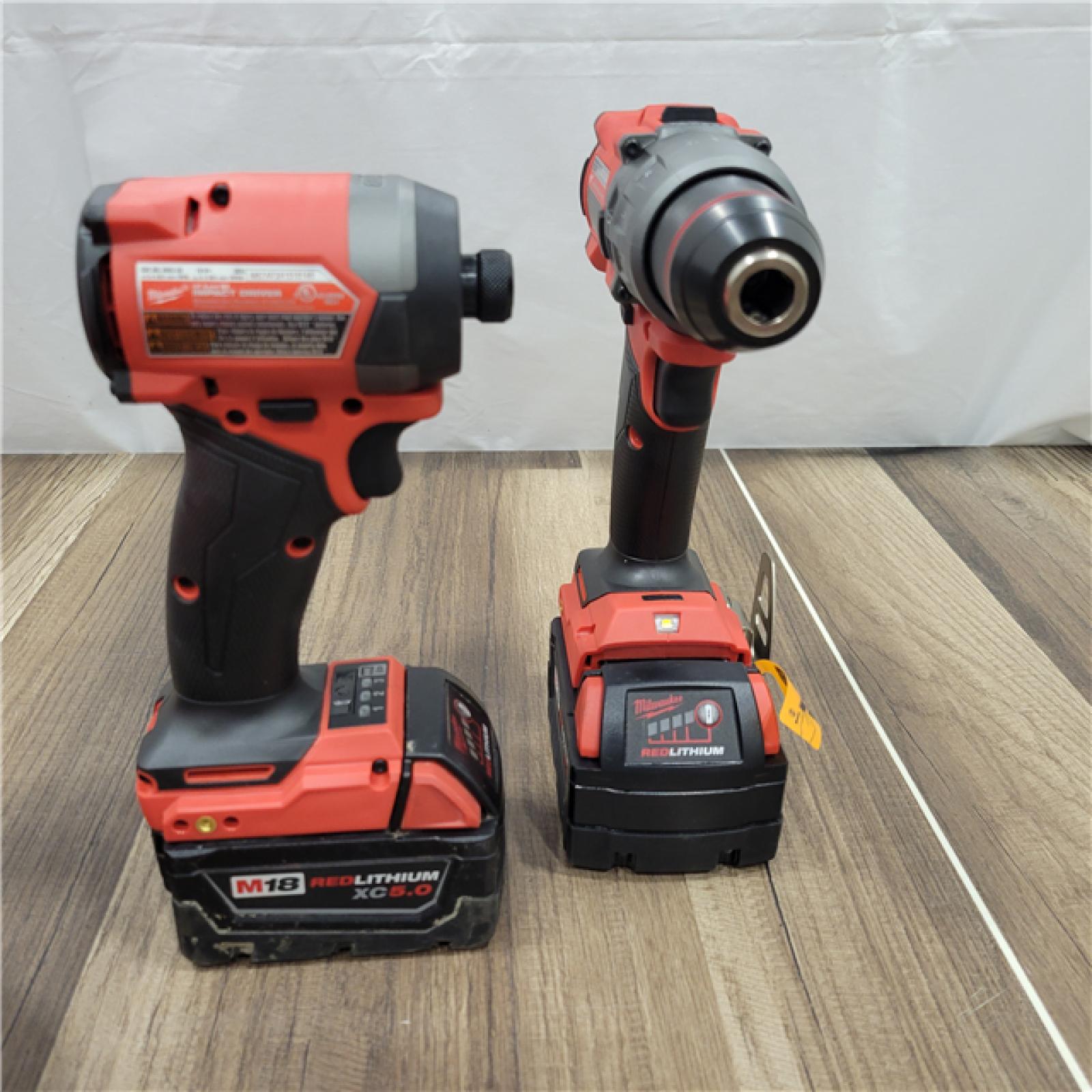 AS-IS MILWAUKEE M18 FUEL 18V Lithium-Ion Brushless Cordless Hammer Drill and Impact Driver Combo Kit (2-Tool) with 2 Batteries