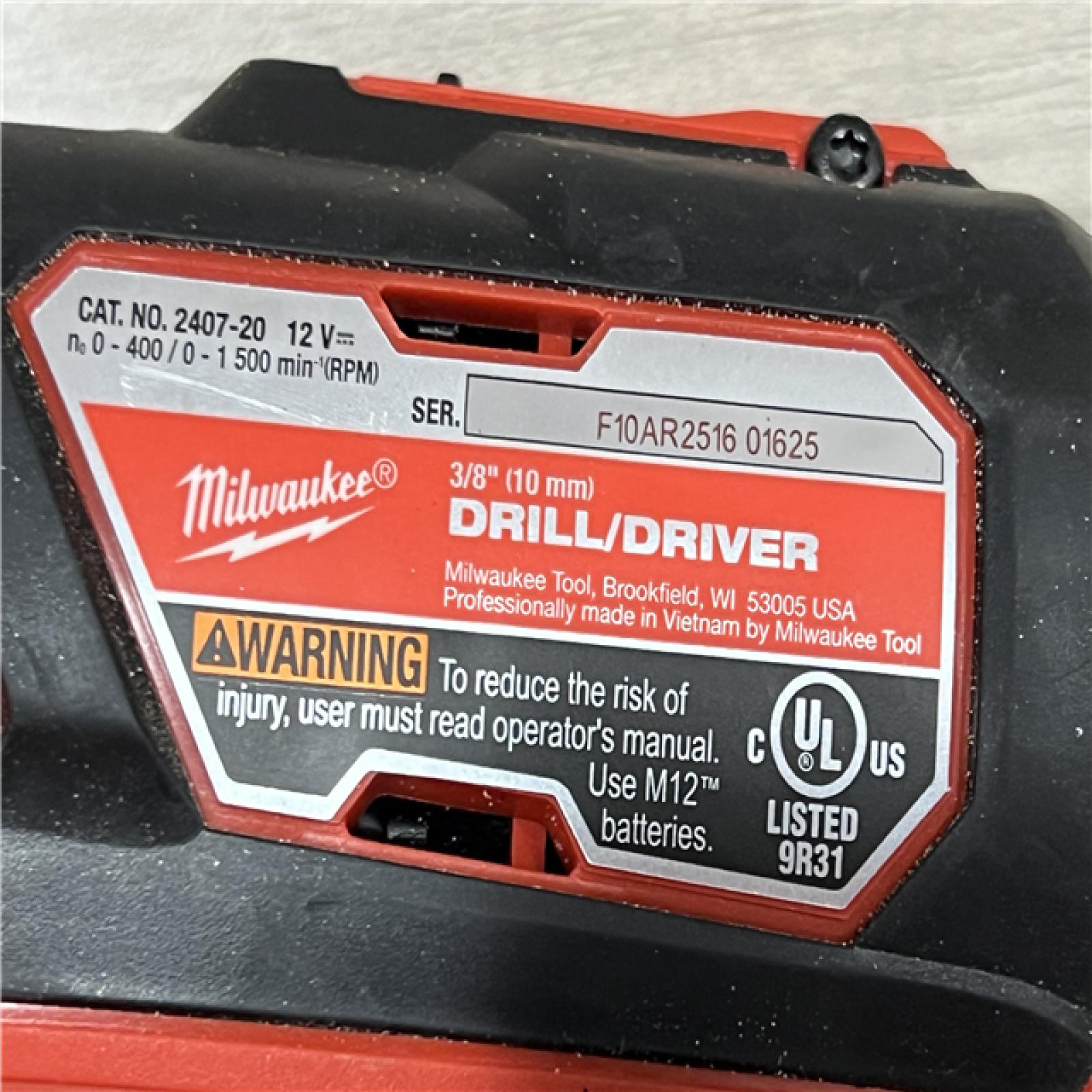 AS-IS Milwaukee 2494-22 M12 Cordless Combination 3/8 Drill / Driver and 1/4 Hex Impact Driver Dual Power Tool Kit (2 Lithium Ion Batteries  Charger  and B