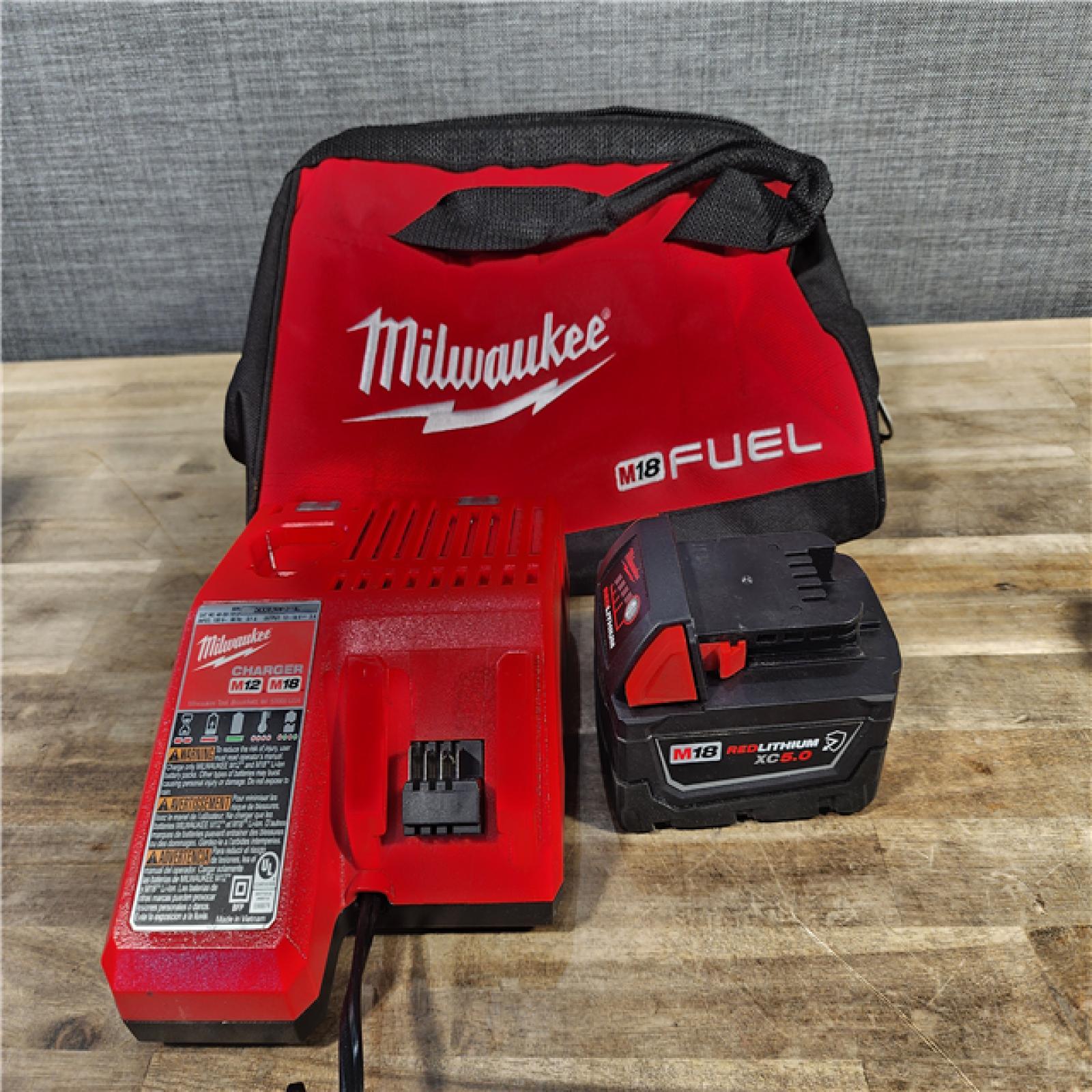 HOUSTON - LOCATION - AS-IS Milwaukee M18 18V Fuel 1/2  Mid-Torque Impact Wrench Cordless Lithium-Ion Brushless with BATTERY & CHARGER