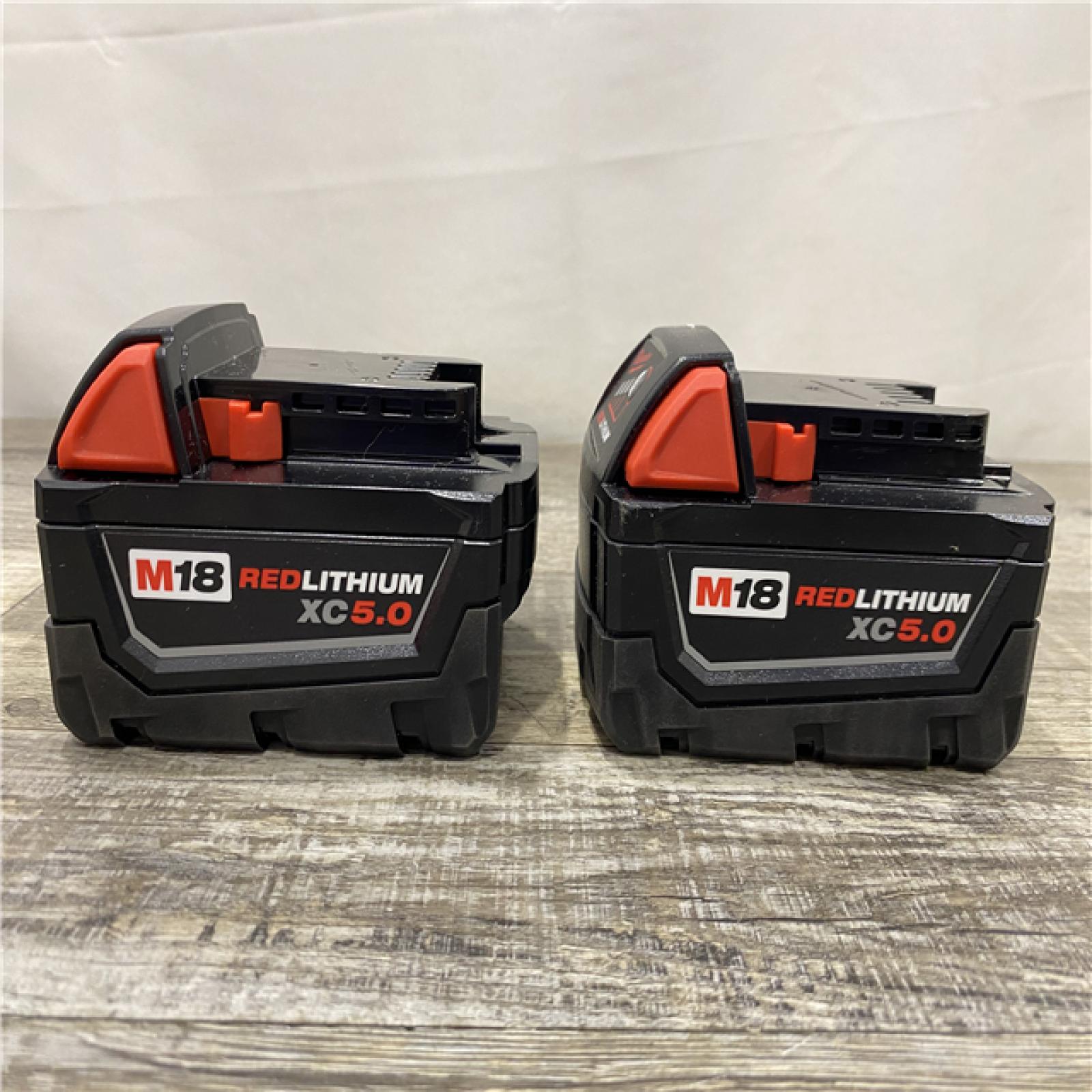 AS-IS Milwaukee 18-Volt Lithium-Ion XC Starter Kit with Two 5.0Ah Batteries and Charger