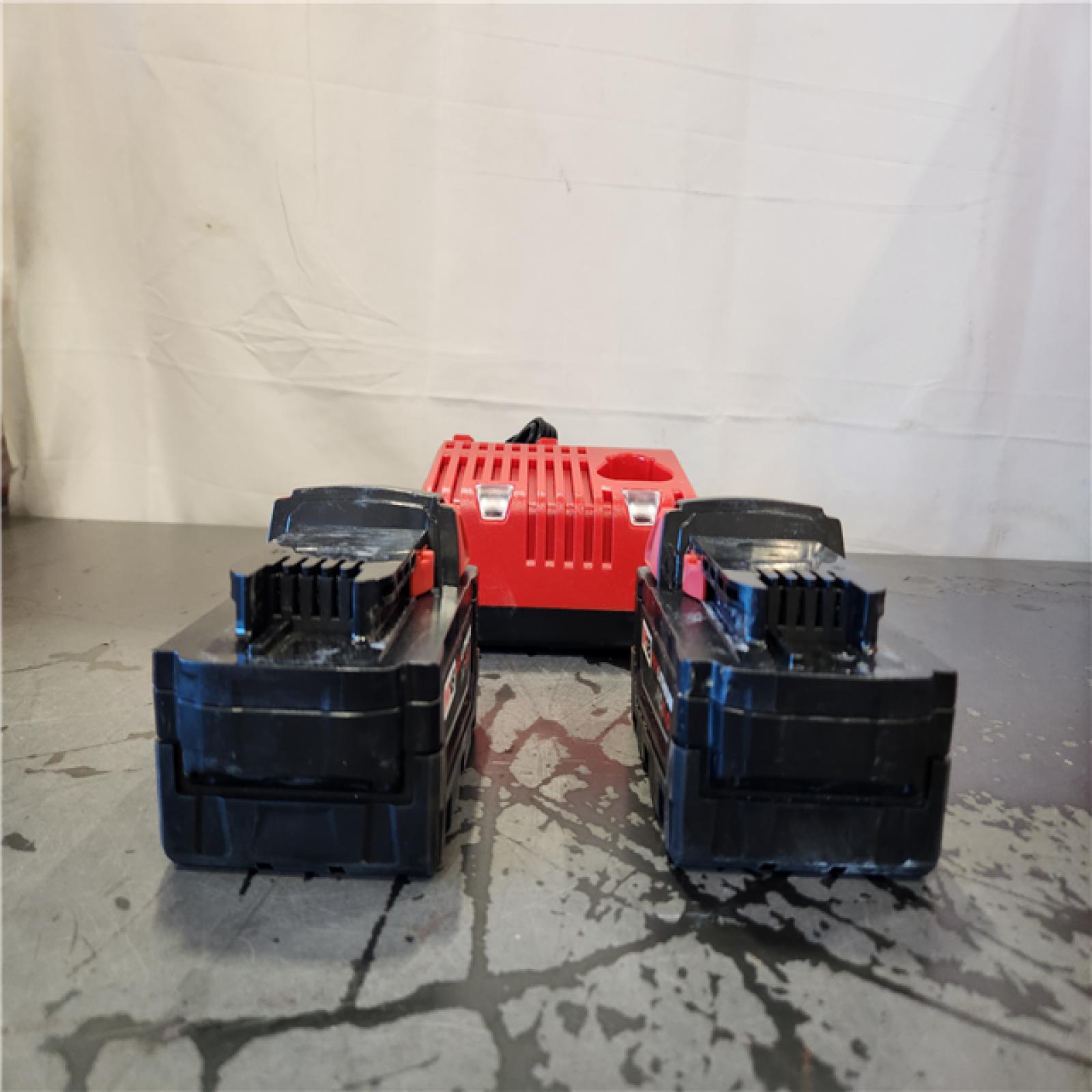 AS-IS- Milwaukee 18-Volt Lithium-Ion XC Starter Kit with Two 5.0Ah Batteries and Charger