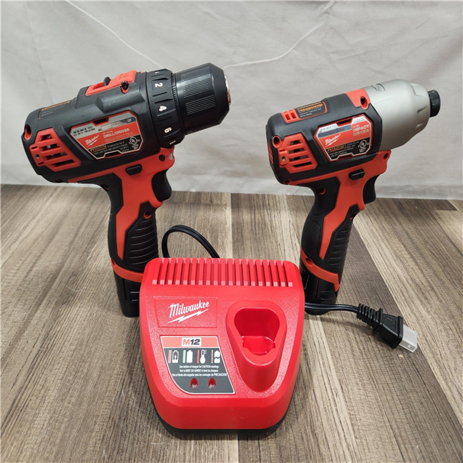AS-IS- Milwaukee M12 Cordless Combination 3/8  Drill / Driver and 1/4  Hex Impact Driver Dual Power Tool Kit (2 Lithium Ion Batteries  Charger  and B