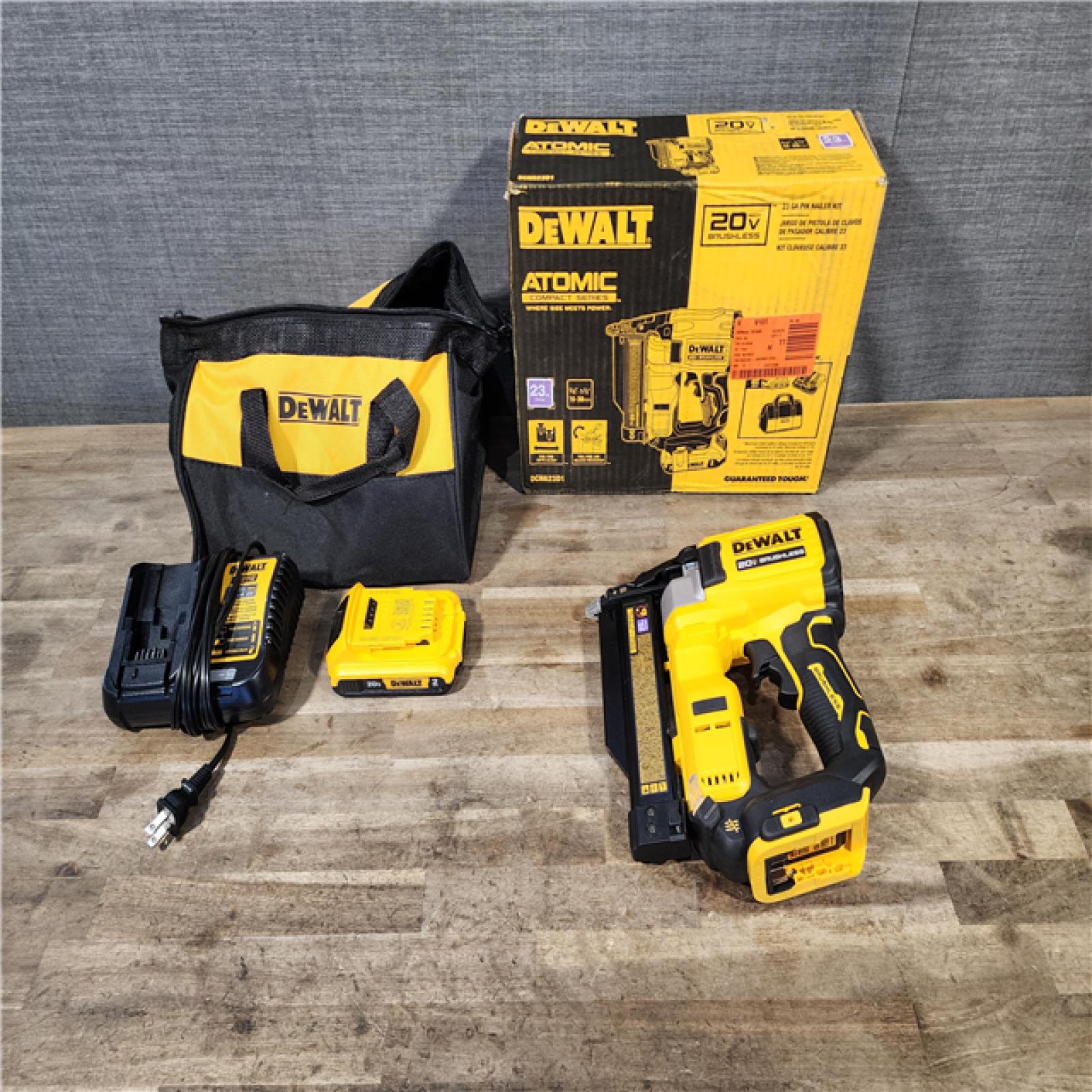 HOUSTON LOCATION - AS-IS DEWALT ATOMIC 20V MAX Lithium Ion Cordless 23 Gauge Pin Nailer Kit with 2.0Ah Battery and Charger