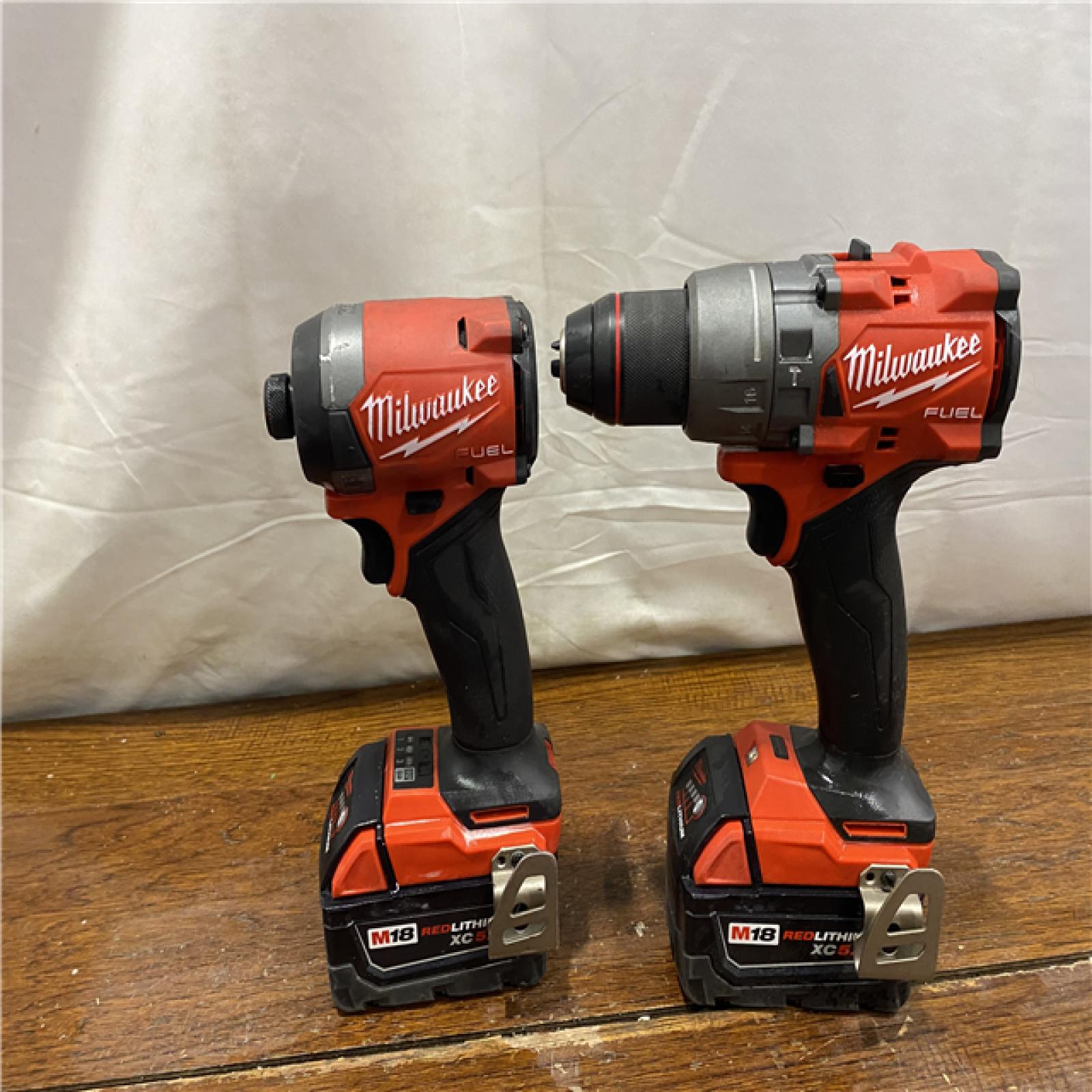 AS-IS MILWAUKEE M18 FUEL 18V Lithium-Ion Brushless Cordless Hammer Drill and Impact Driver Combo Kit (2-Tool) with 2 Batteries