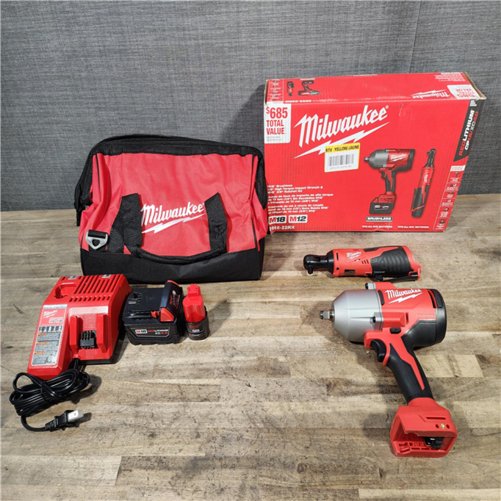 HOUSTON LOCATION - AS-IS (APPEARS LIKE NEW) Milwaukee M12/M18 12/18V Lithium-Ion Cordless 3/8 in. Ratchet and 1/2 in. High Torque Impact Wrench with Friction Ring Combo Kit
