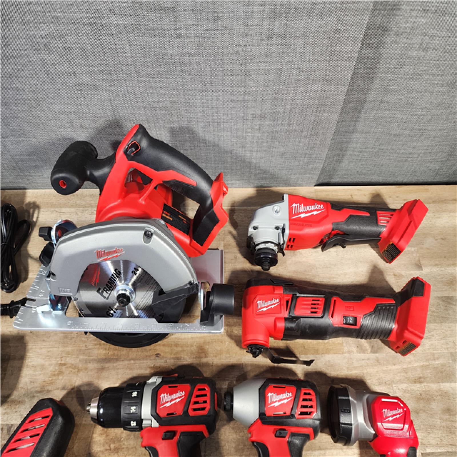 HOUSTON LOCATION - AS-IS MILWAUKEE 7 TOOL COMBO KIT W/ (2) BATTERY & CHARGER