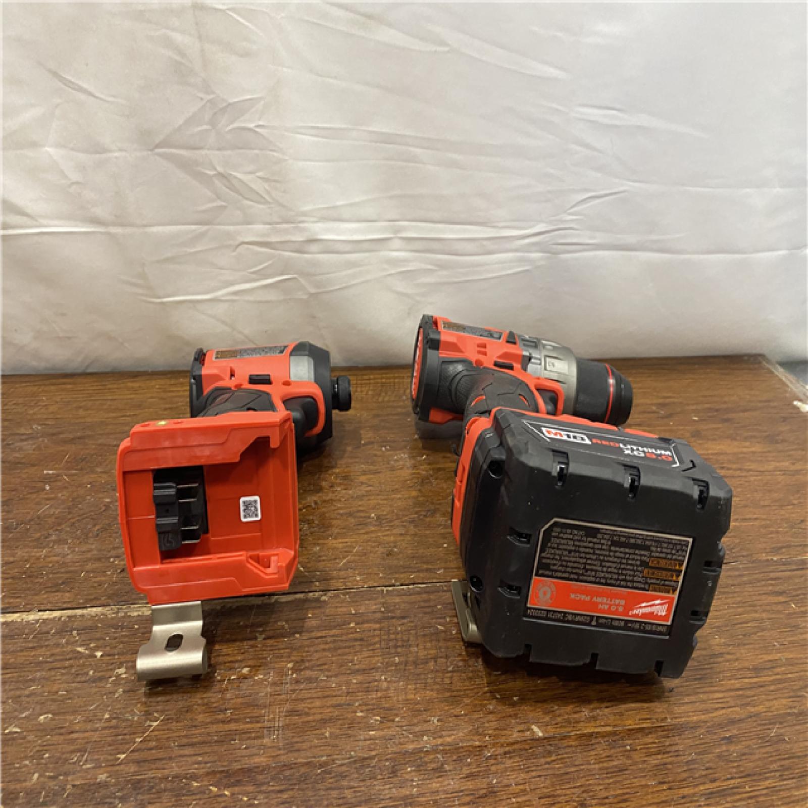 AS-IS MILWAUKEE M18 FUEL 18V Lithium-Ion Brushless Cordless Hammer Drill and Impact Driver Combo Kit (2-Tool) with 2 Batteries