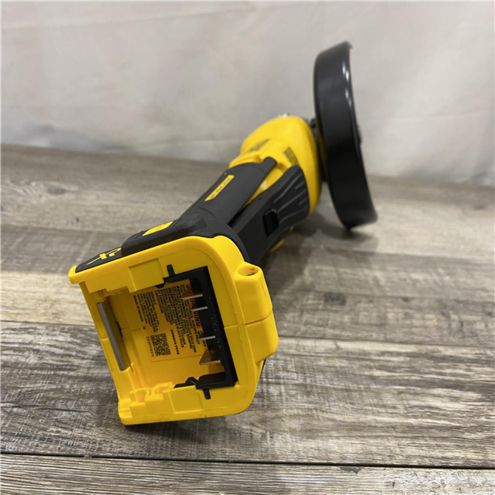 AS-IS DEWALT 20V MAX XR Cordless Brushless 4.5 in. Paddle Switch Small Angle Grinder with Kickback Brake (Tool Only)