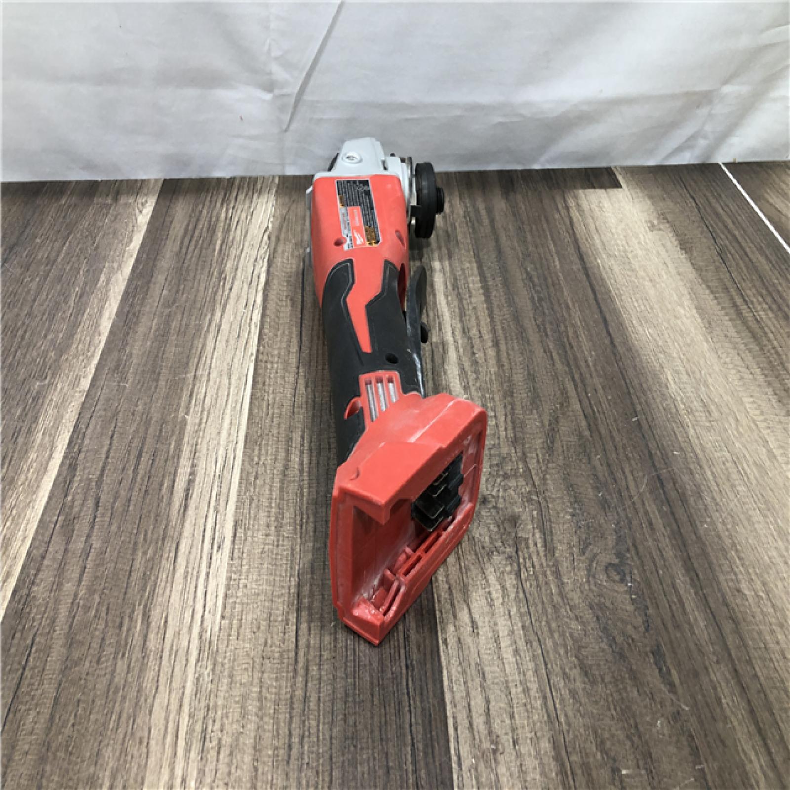 AS-IS Milwaukee 18V Lithium-Ion Brushless Cordless 4-1/2 in./5 in. Grinder w/Paddle Switch (Tool-Only)