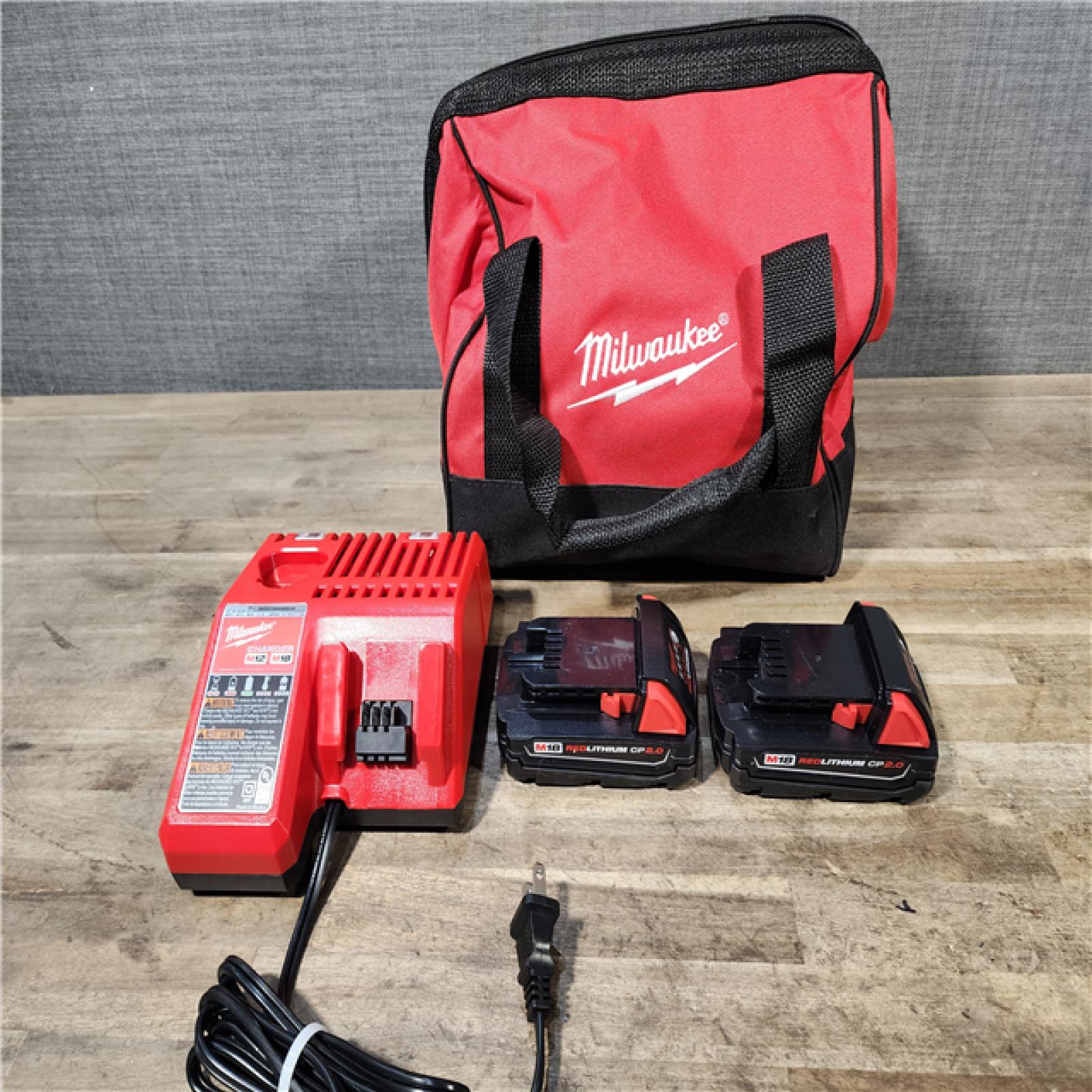 HOUSTON LOCATION - AS-IS Milwaukee M18 18V Lithium-Ion Brushless Cordless Compact Drill/Impact Combo Kit (2-Tool) W/(2) 2.0 Ah Batteries, Charger & Bag