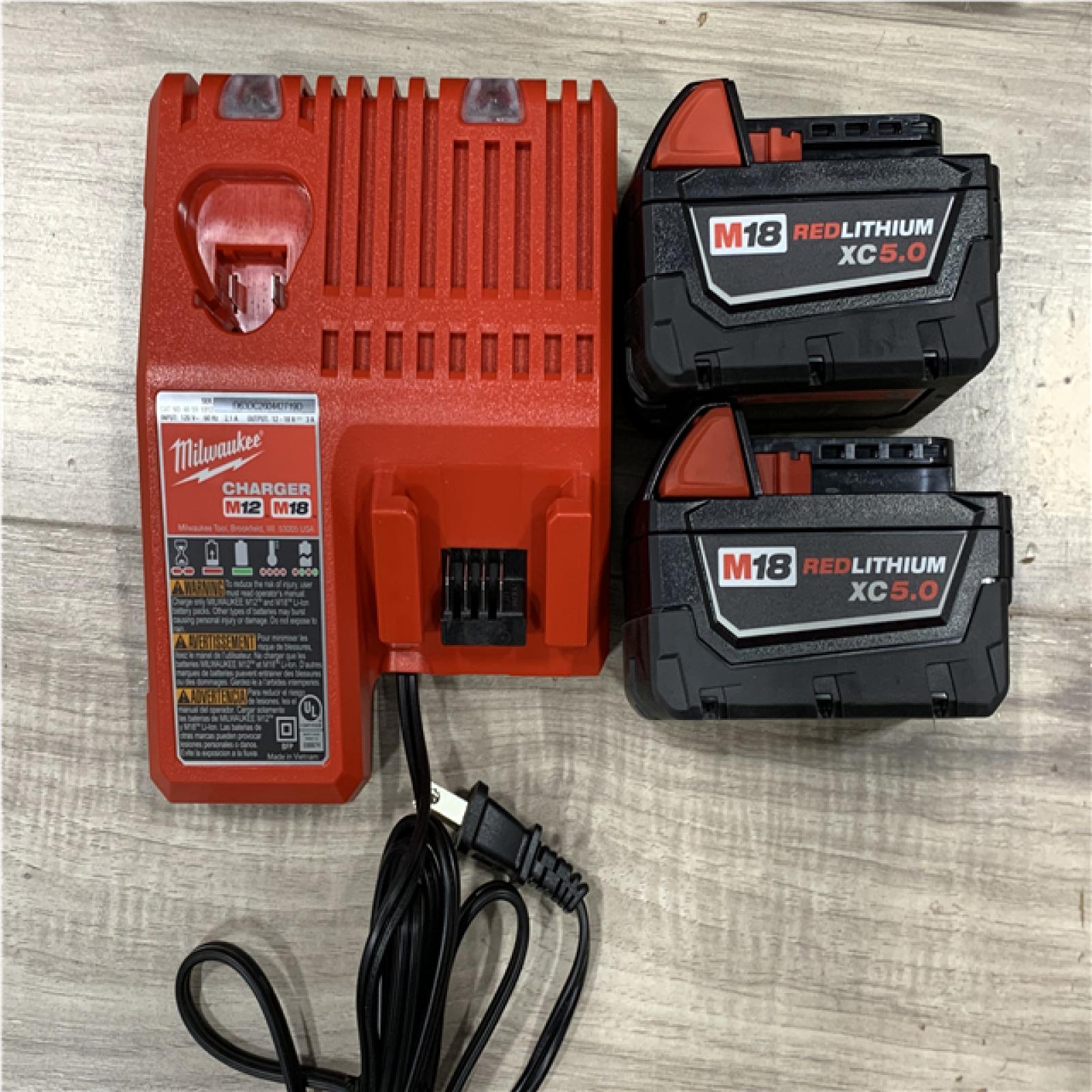 AS-IS Milwaukee FUEL 18V Lithium-Ion Brushless Cordless Hammer Drill and Impact Driver Combo Kit