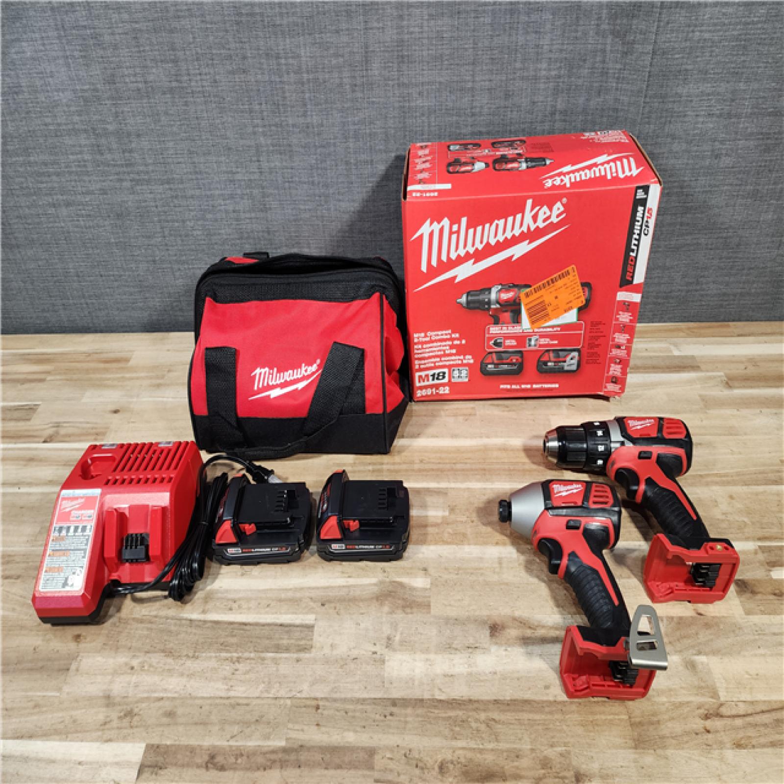 HOUSTON LOCATION - AS-IS Milwaukee  18V Lithium-Ion Cordless Drill Driver/Impact Driver Combo Kit