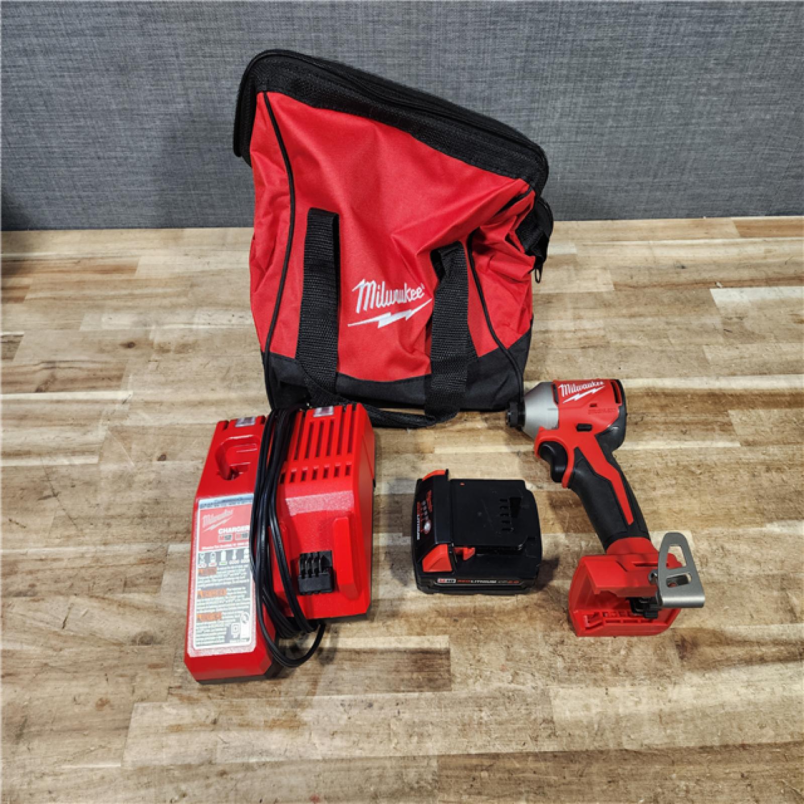 HOUSTON LOCATION - AS - IS Milwaukee 18-Volt Lithium-Ion Compact Brushless Cordless 1/4 in. Impact Driver Kit
