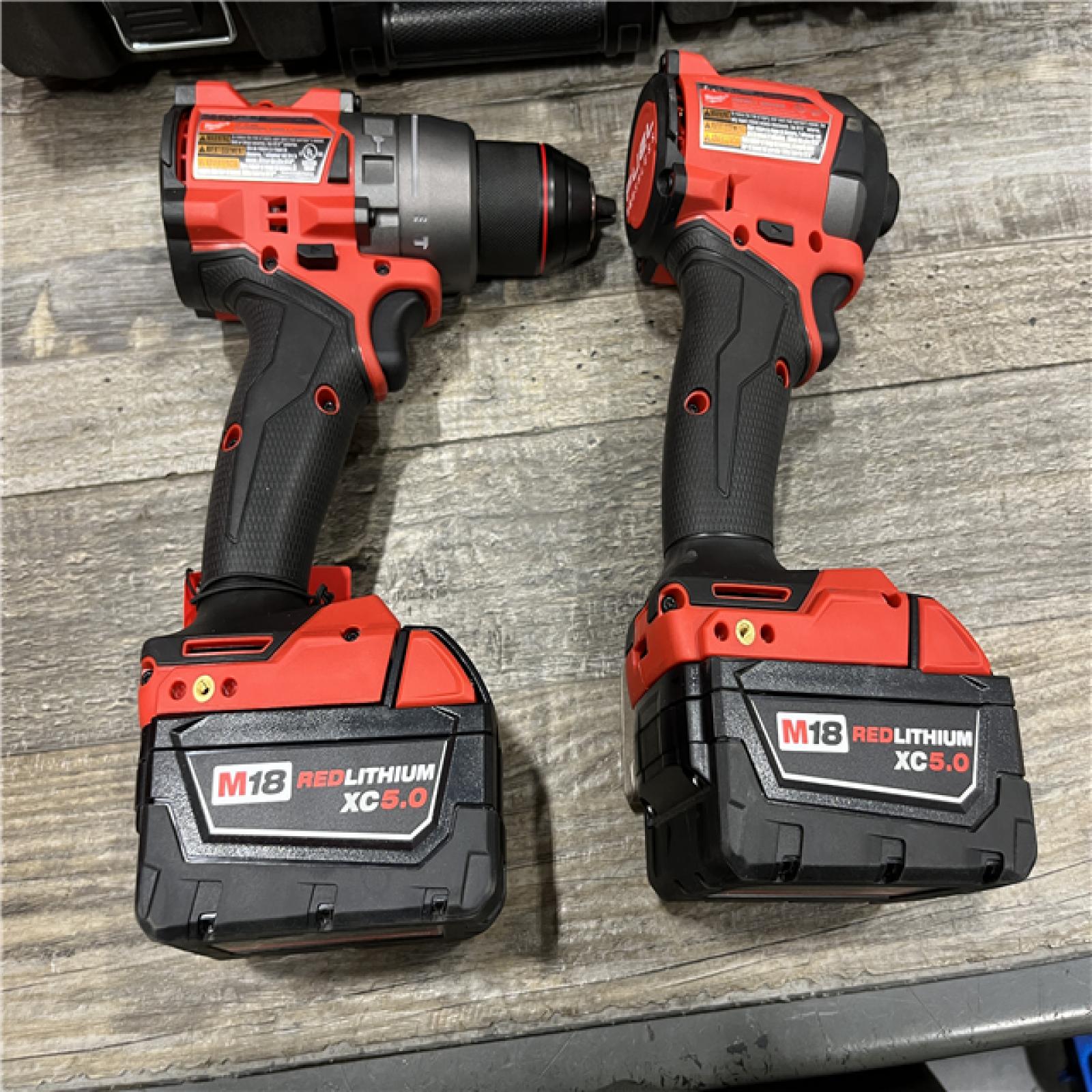 AS-IS Milwaukee FUEL 18V Lithium-Ion Brushless Cordless Hammer Drill and Impact Driver Combo Kit