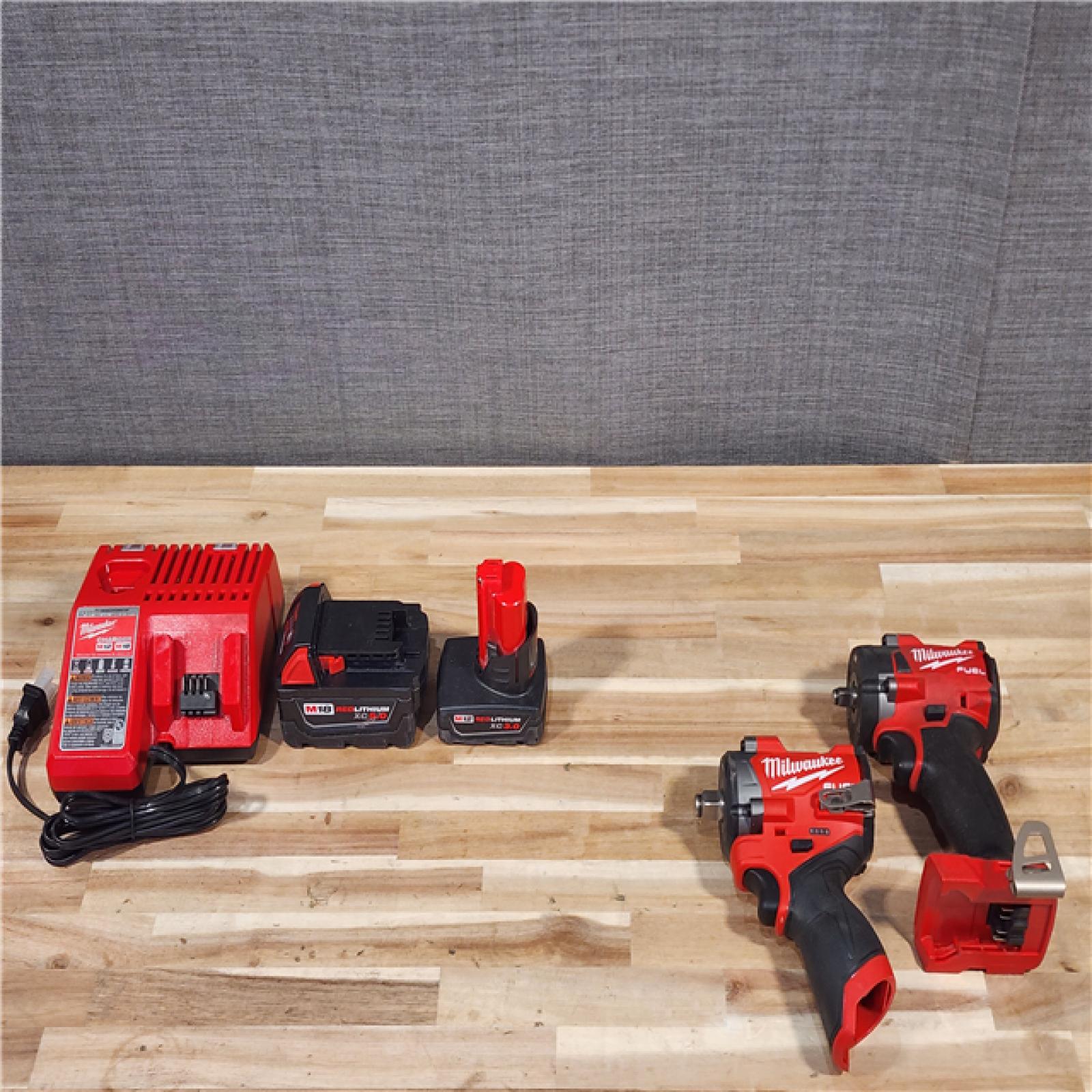 HOUSTON LOCATION - AS-IS MILWAUKEE 2 TOOL COMBO KIT W/ (2) BATTERY & CHARGER