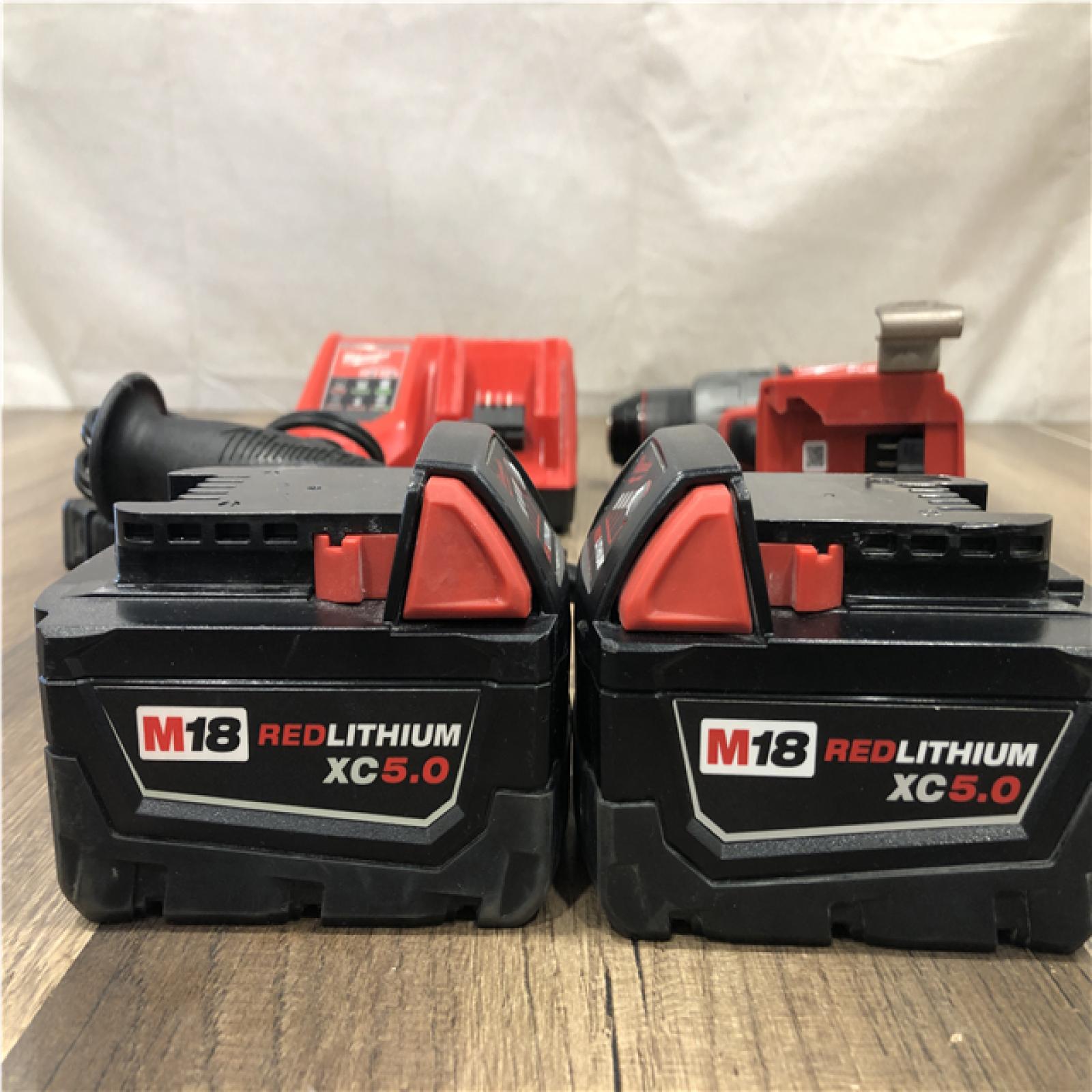 AS-IS Milwaukee FUEL 18V Lithium-Ion Brushless Cordless 1/2 in. Hammer Drill Driver Kit