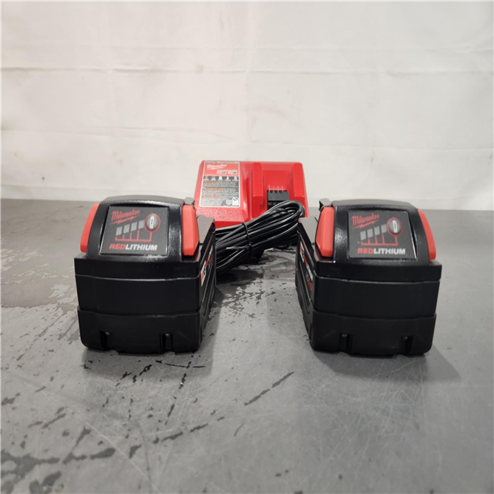 AS-IS- Milwaukee M18 18-Volt Lithium-Ion XC Starter Kit with Two 5.0Ah Batteries and Charger