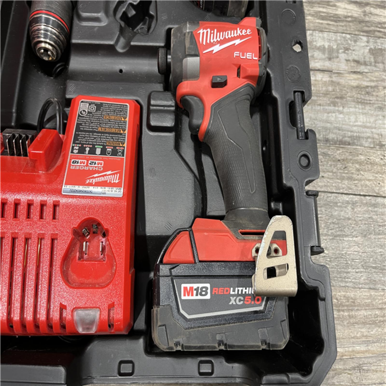 AS-IS Milwaukee FUEL 18V Lithium-Ion Brushless Cordless Hammer Drill and Impact Driver Combo Kit