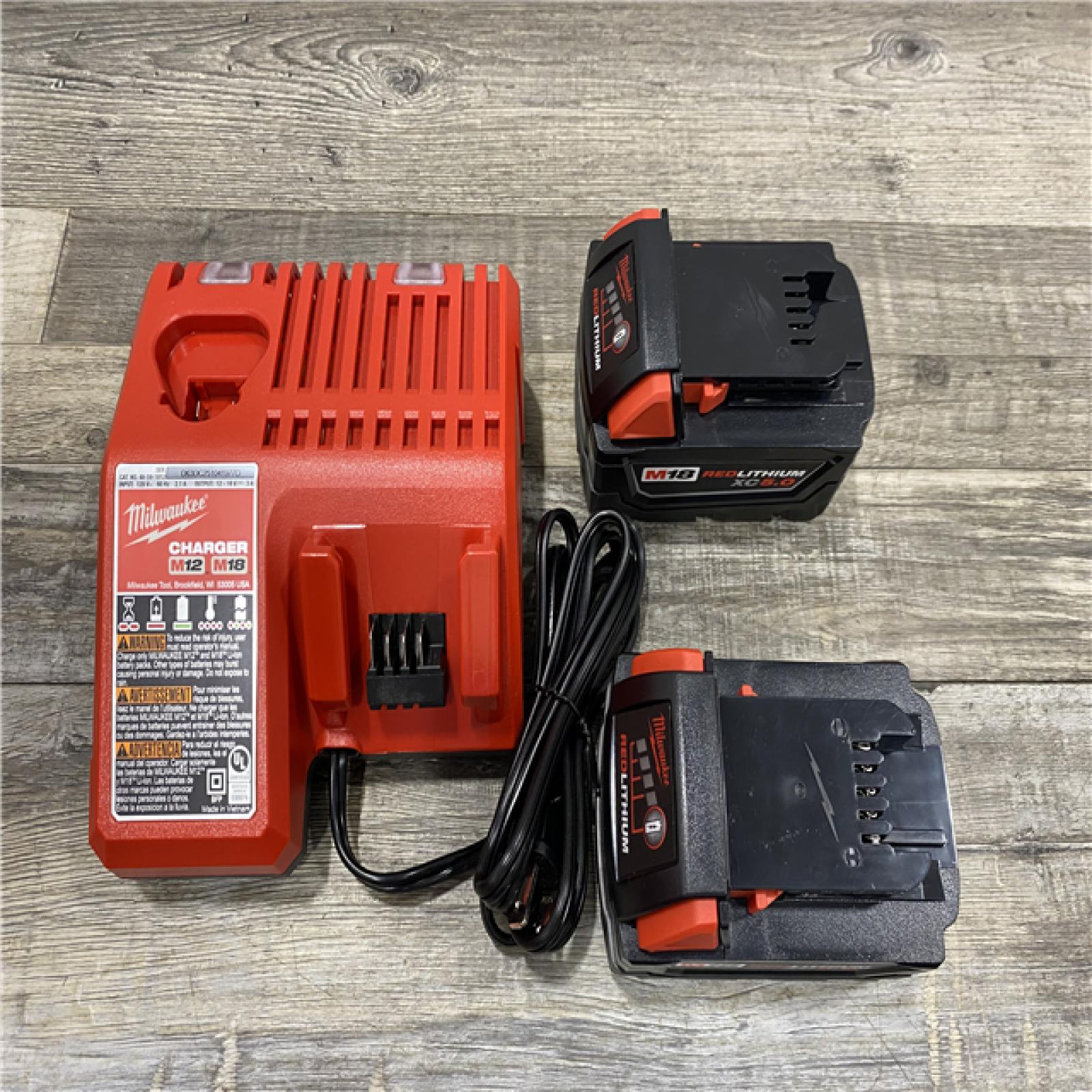 AS-IS Milwaukee 18-Volt Lithium-Ion XC Starter Kit with Two 5.0Ah Batteries and Charger