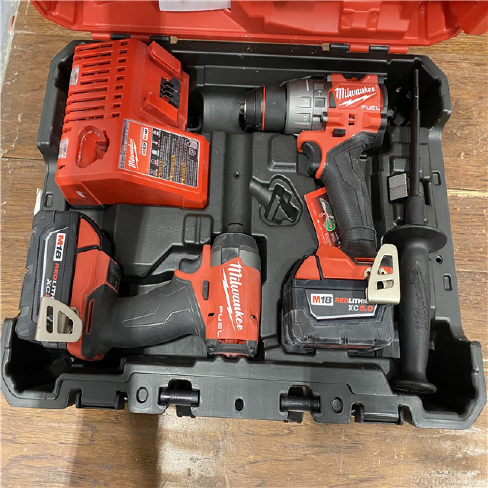 AS-IS MILWAUKEE M18 FUEL 18V Lithium-Ion Brushless Cordless Hammer Drill and Impact Driver Combo Kit (2-Tool) with 2 Batteries