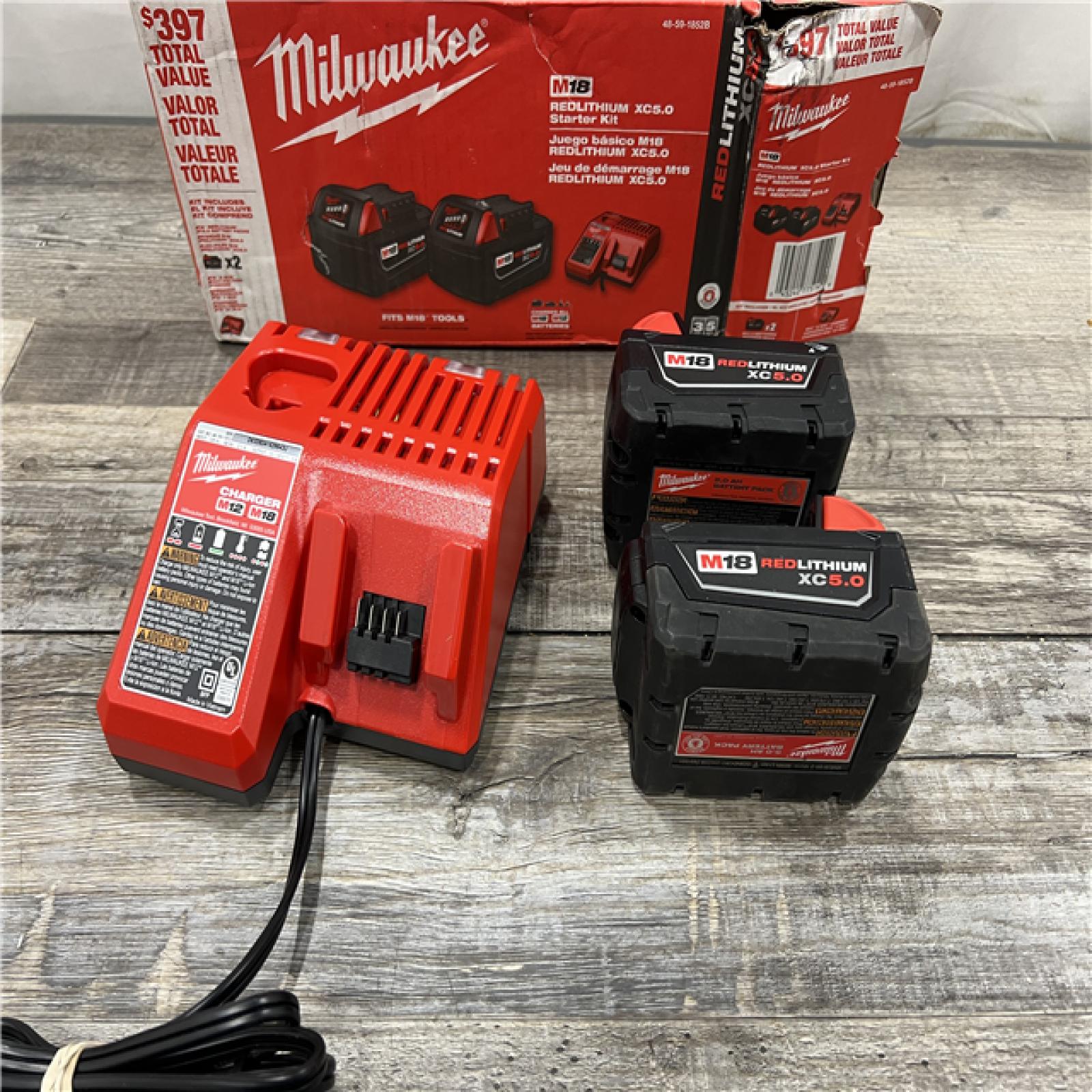 AS-IS Milwaukee M18 18-Volt Lithium-Ion XC Starter Kit with Two 5.0Ah Batteries / Charger