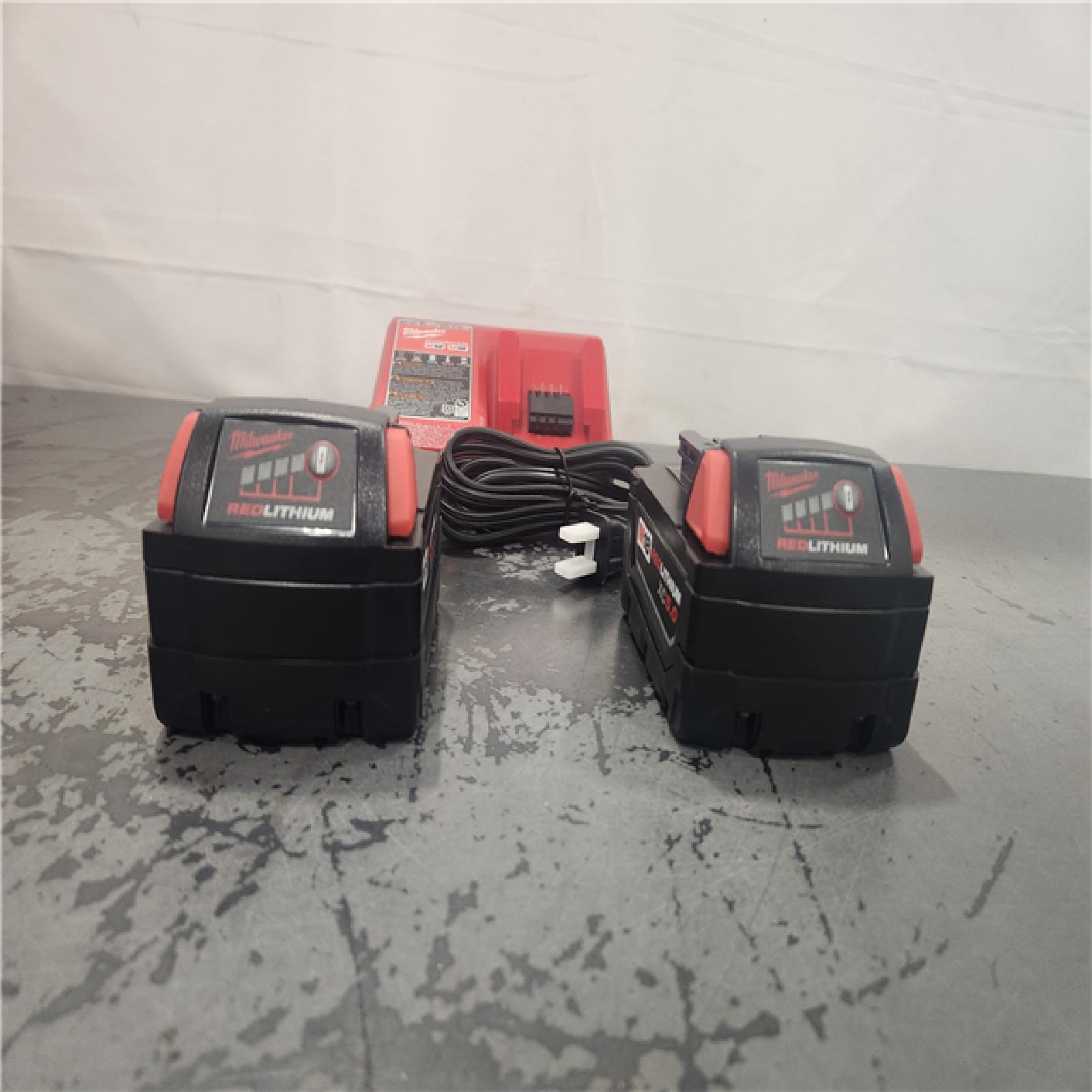 AS-IS- Milwaukee 18-Volt Lithium-Ion XC Starter Kit with Two 5.0Ah Batteries and Charger
