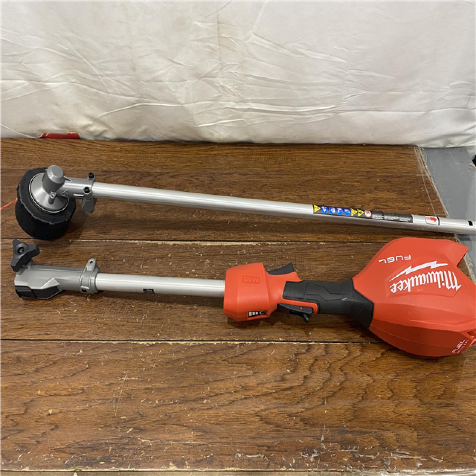 AS-IS M18 FUEL 18V 16 in. Brushless Cordless Battery Powered String Trimmer W/QUIK-LOK Attachment Capability & 8.0 Ah Battery