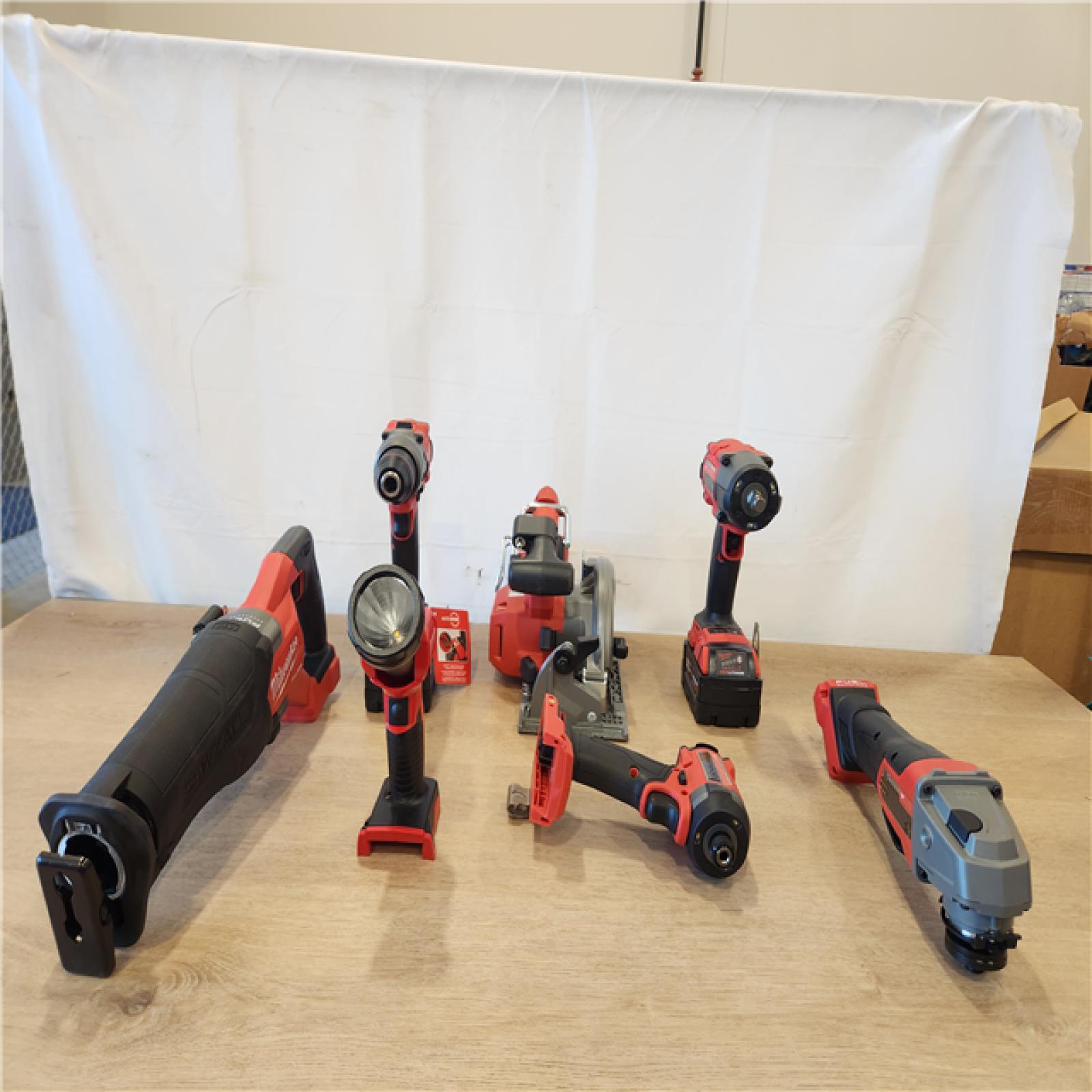 AS-IS- Milwaukee M18 FUEL 18V Lithium-Ion Brushless Cordless Combo Kit with Two 5.0 Ah Batteries  1 Charger  2 Tool Bags (7-Tool)
