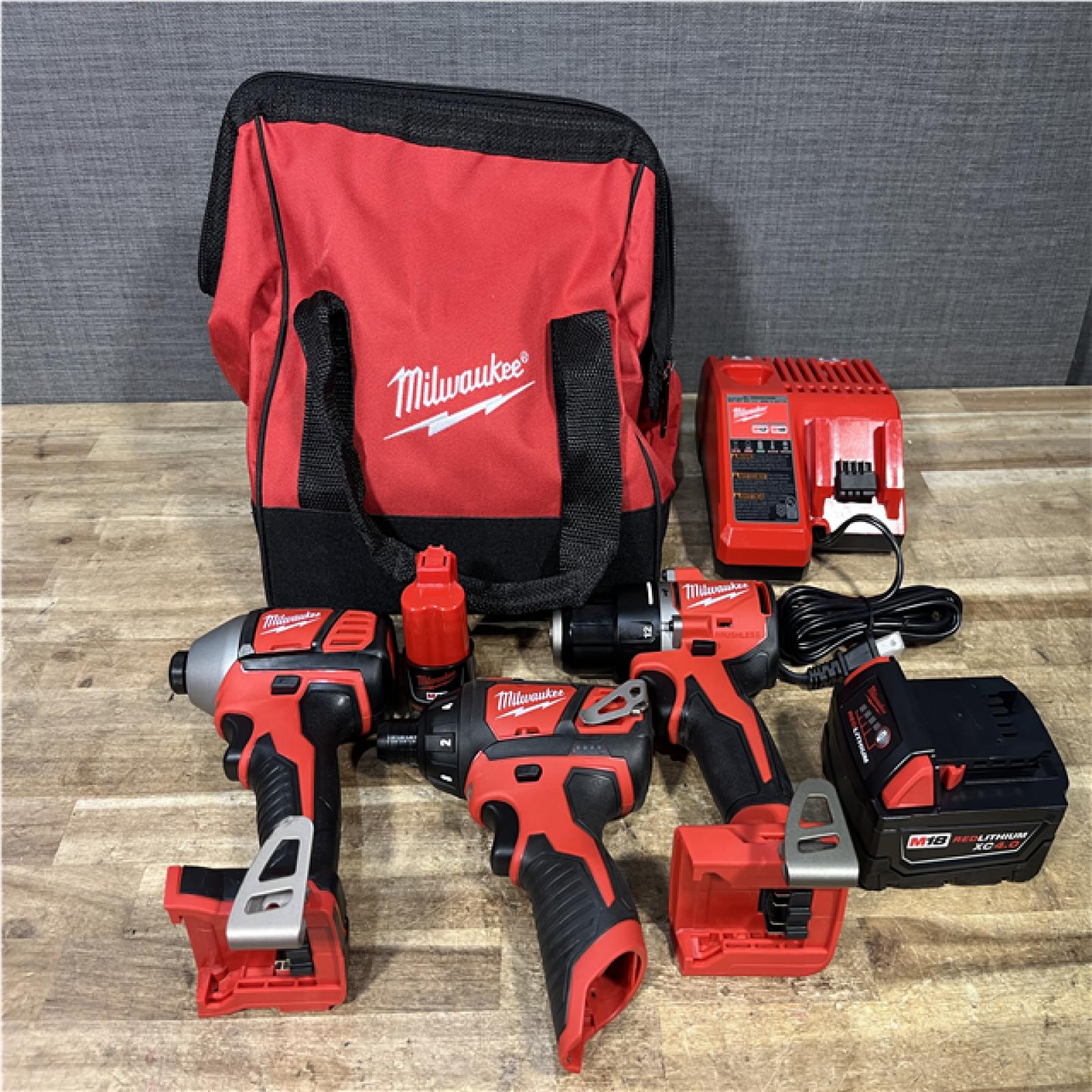 Houston Location Milwaukee Screwdriver and Impact Driver and Hammer Drill Driver and Batteries QTY/2 with Charger