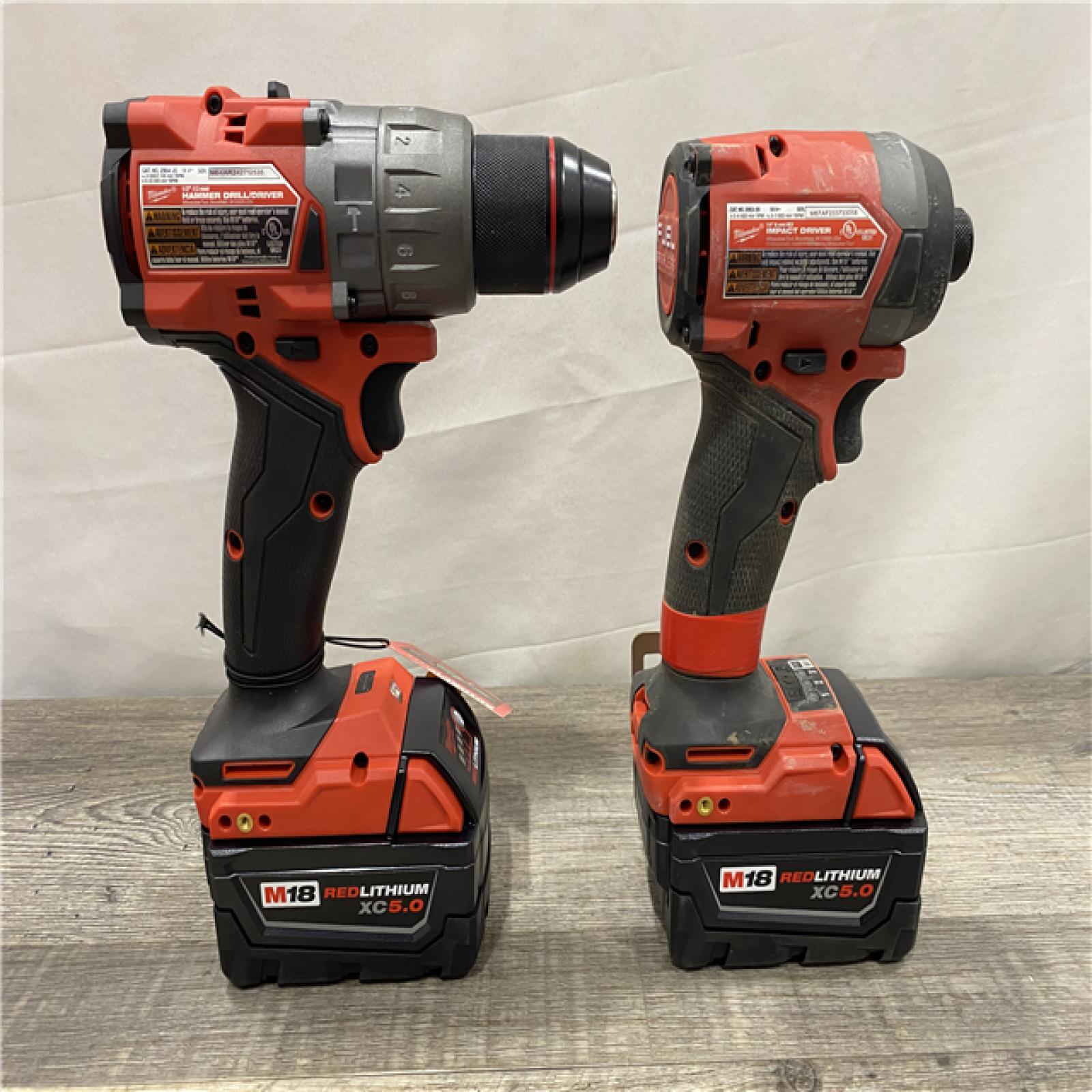 AS-IS Milwaukee FUEL 18V Lithium-Ion Brushless Cordless Hammer Drill and Impact Driver Combo Kit