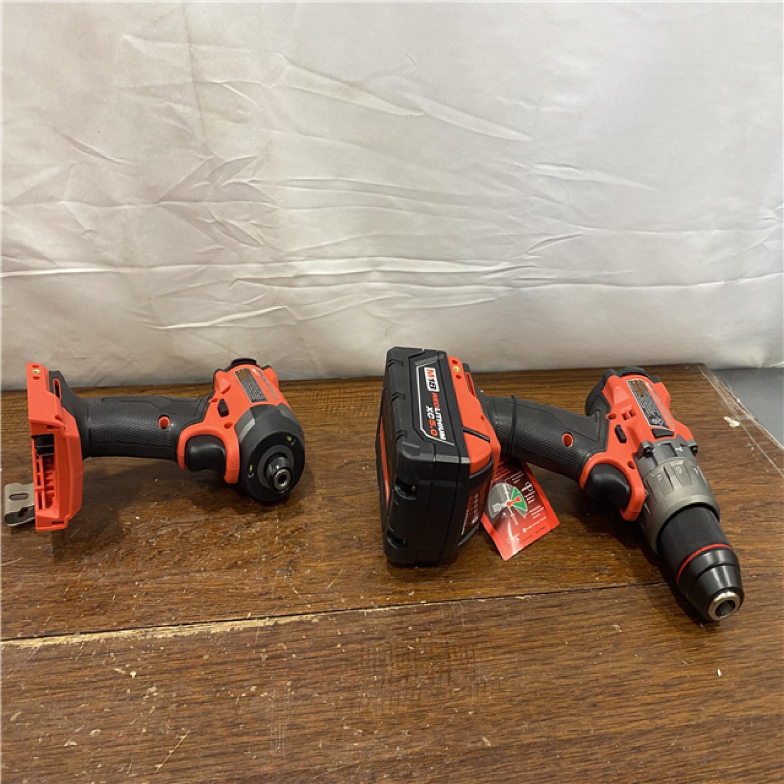 AS-IS MILWAUKEE M18 FUEL 18V Lithium-Ion Brushless Cordless Hammer Drill and Impact Driver Combo Kit (2-Tool) with 2 Batteries