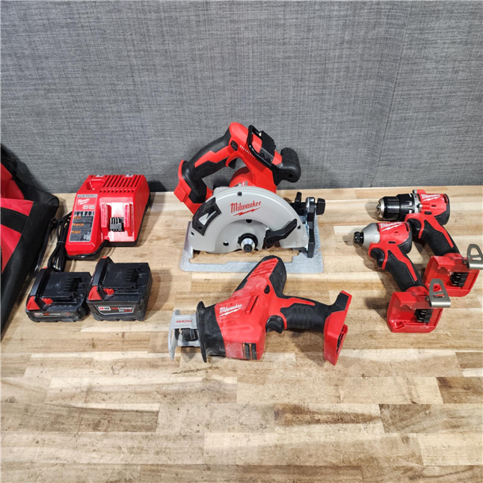 HOUSTON LOCATION - AS-IS MILWAUKEE 4 TOOL COMBO KIT W/ (2) BATTERY & CHARGER