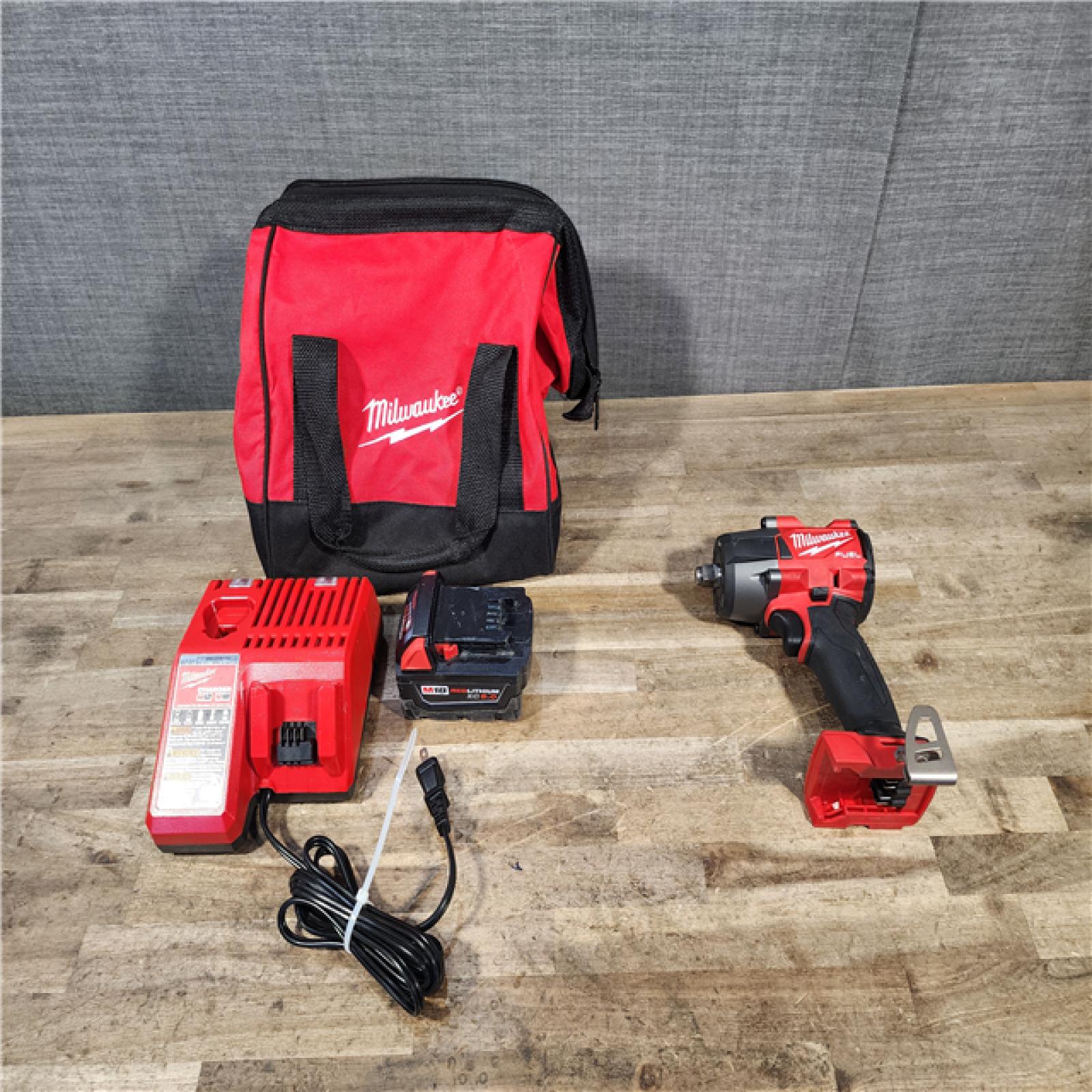 HOUSTON LOCATION - AS-IS Milwaukee FUEL Gen-2 18V Lithium-Ion Brushless Cordless Mid Torque 1/2 in. Impact Wrench w/Friction Ring W/ BATTERY & CHARGER