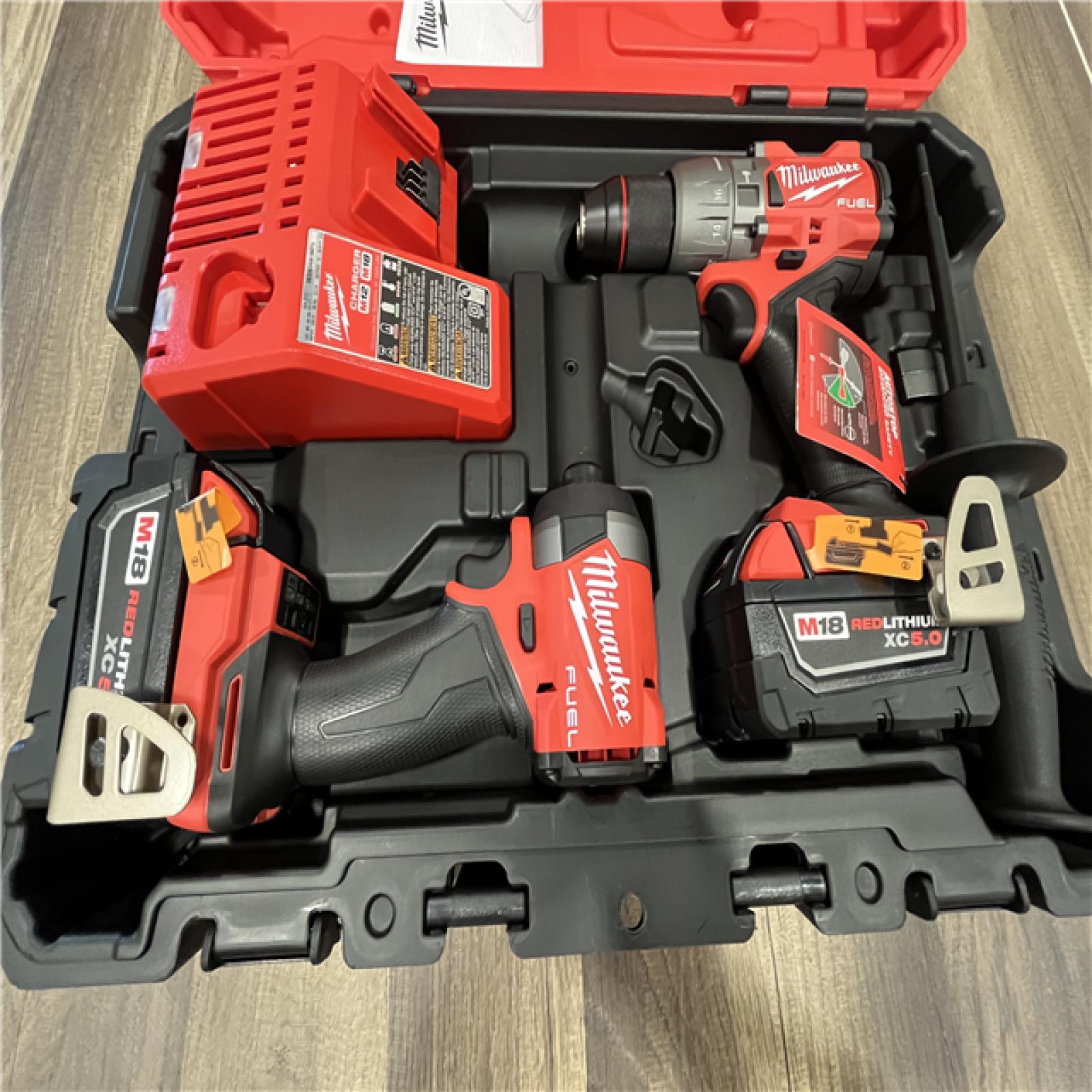 AS-IS Milwaukee M18 FUEL 18V Lithium-Ion Brushless Cordless Hammer Drill and Impact Driver Combo Kit (2-Tool) with 2 Batteries