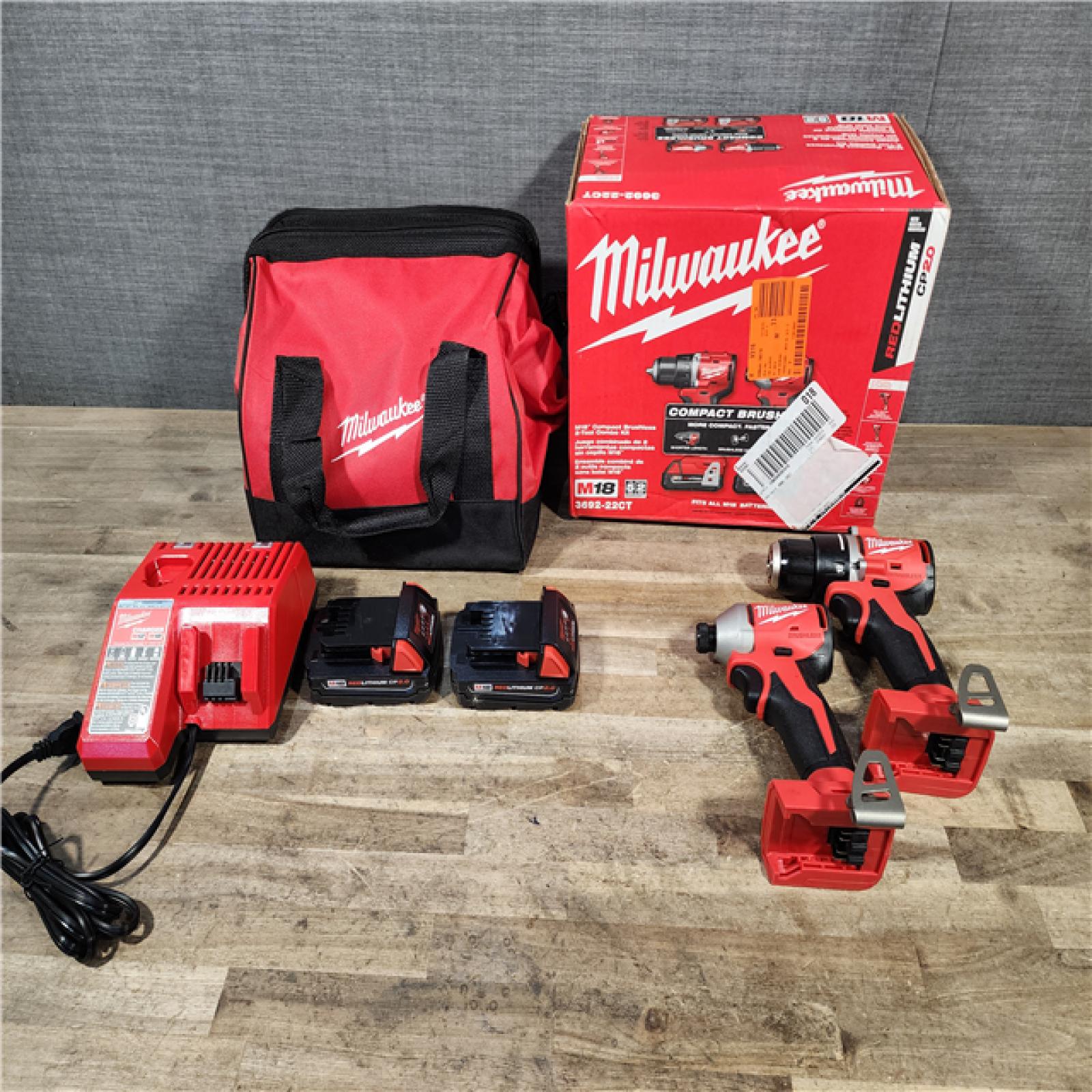 HOUSTON LOCATION - AS-IS Milwaukee M18 18V Lithium-Ion Brushless Cordless Compact Drill/Impact Combo Kit (2-Tool) W/(2) 2.0 Ah Batteries  Charger & Bag