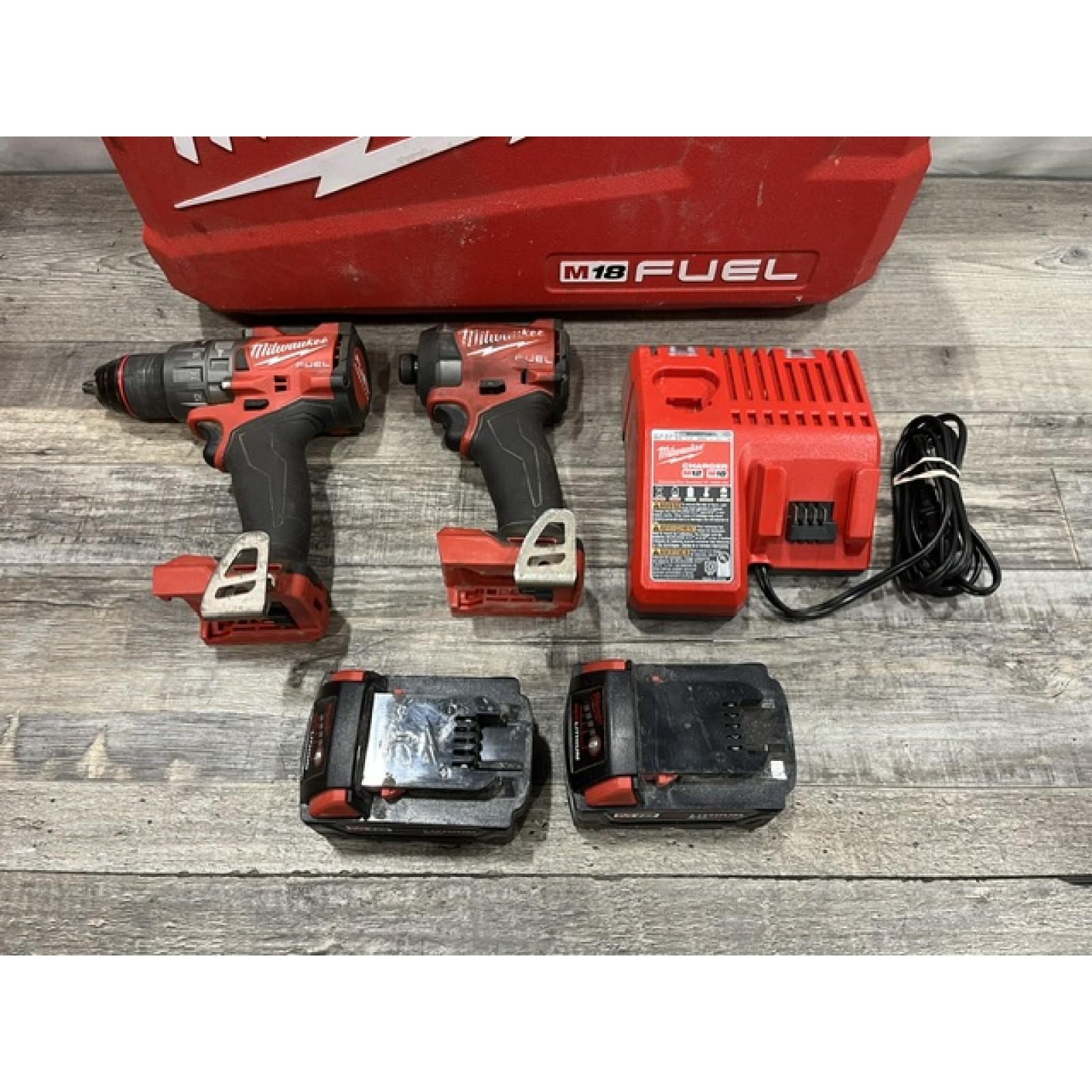 AS-IS Milwaukee FUEL 18V Lithium-Ion Brushless Cordless Hammer Drill and Impact Driver Combo Kit
