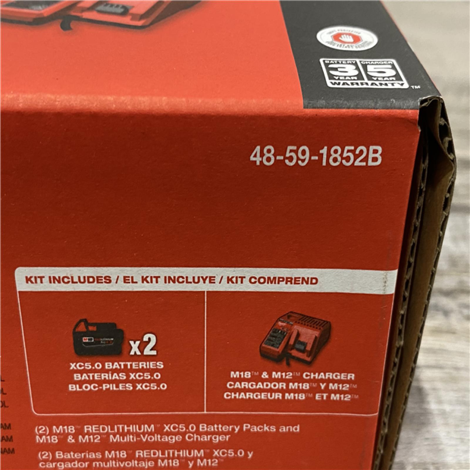 NEW - Milwaukee 18-Volt Lithium-Ion XC Starter Kit with Two 5.0Ah Batteries and Charger