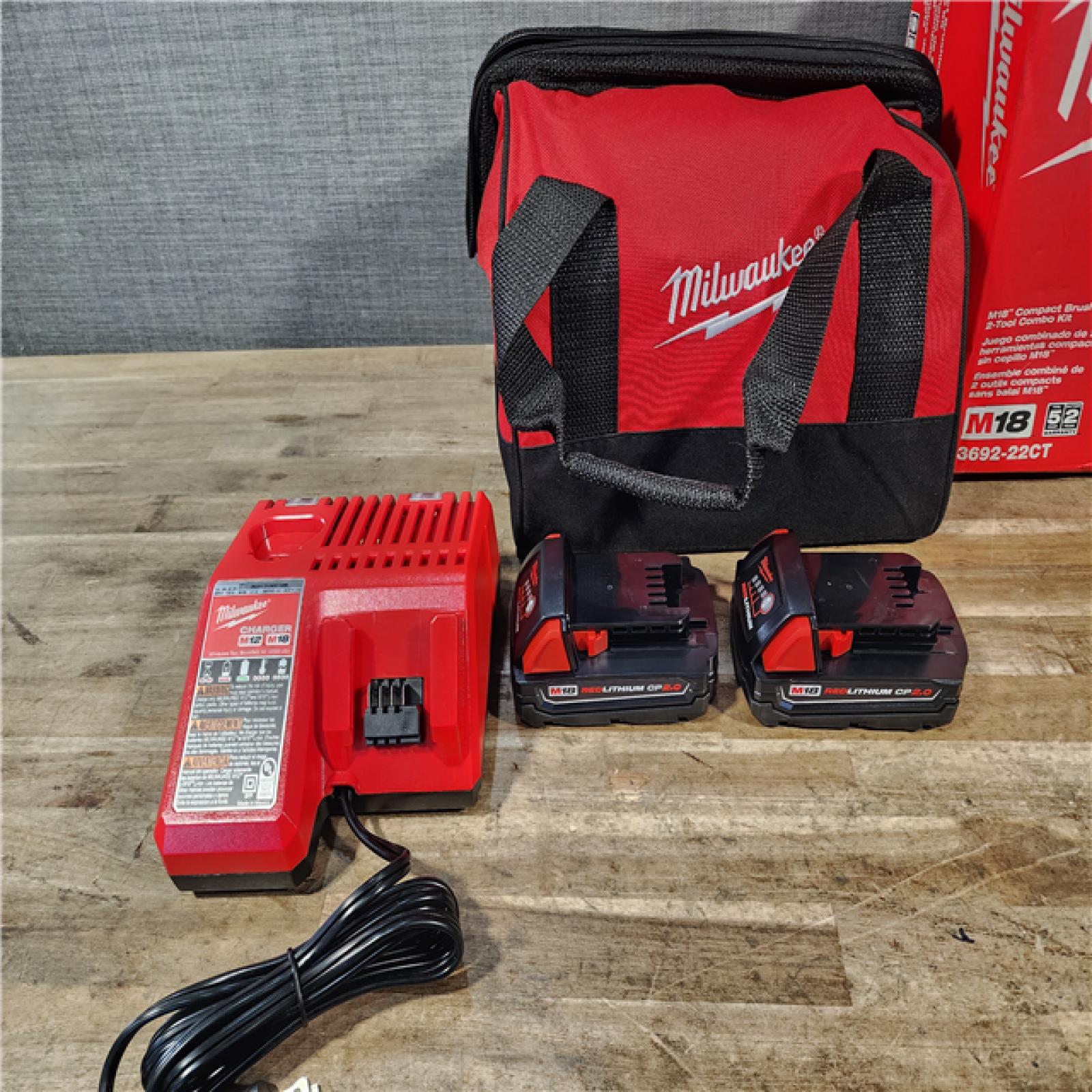 HOUSTON LOCATION - AS-IS Milwaukee M18 18V Lithium-Ion Brushless Cordless Compact Drill/Impact Combo Kit (2-Tool) W/(2) 2.0 Ah Batteries  Charger & Bag