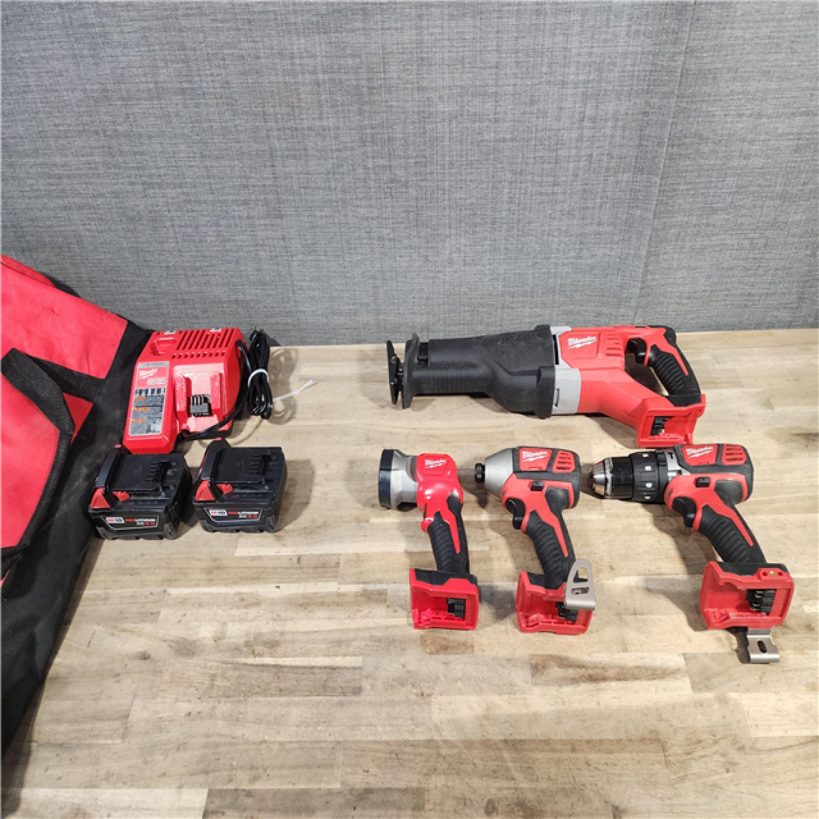 HOUSTON LOCATION - AS-IS MILWAUKEE 4 TOOL COMBO KIT W/ (2) BATTERY & CHARGER