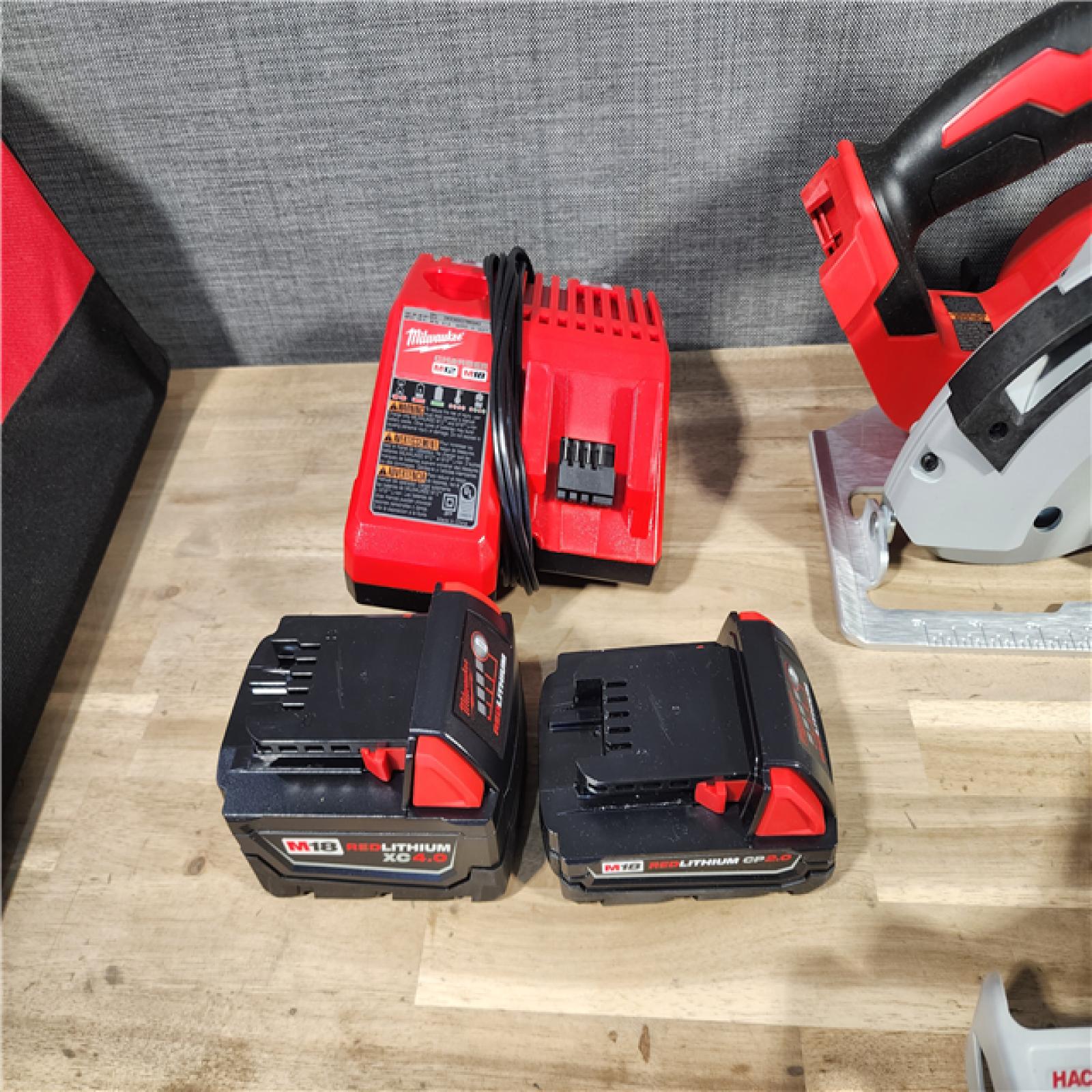 HOUSTON LOCATION - AS-IS Milwaukee M18 18-Volt Lithium-Ion Brushless Cordless Combo Kit (4-Tool) with 2-Batteries, 1-Charger and Tool Bag