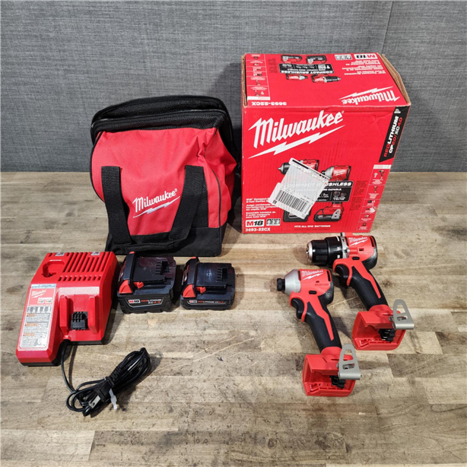 HOUSTON LOCATION - AS-IS M18 18-Volt Lithium-Ion Brushless Cordless Compact Hammer Drill/Impact Combo Kit (2-Tool) with (2) Batteries  Bag