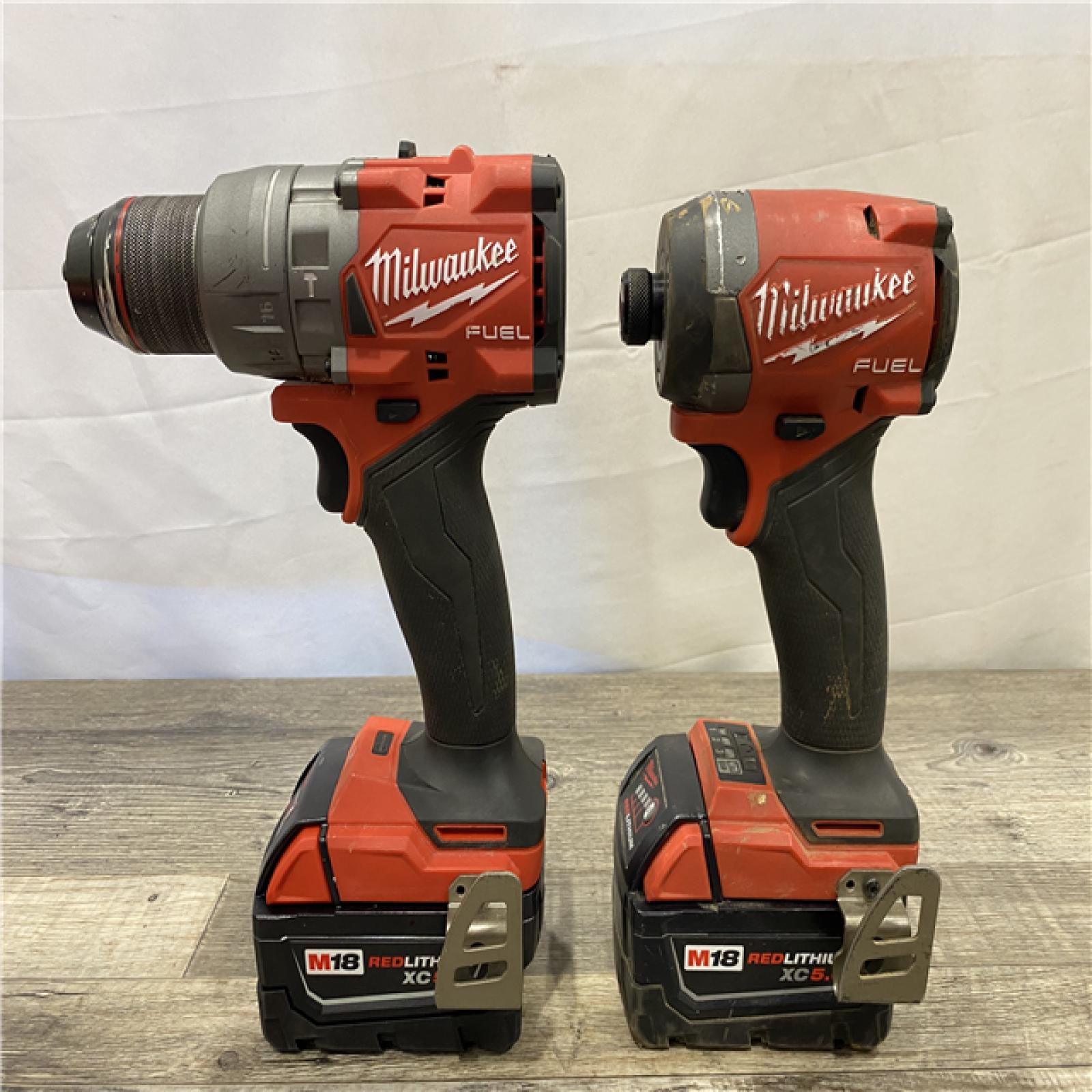 AS-IS Milwaukee FUEL 18V Lithium-Ion Brushless Cordless Hammer Drill and Impact Driver Combo Kit